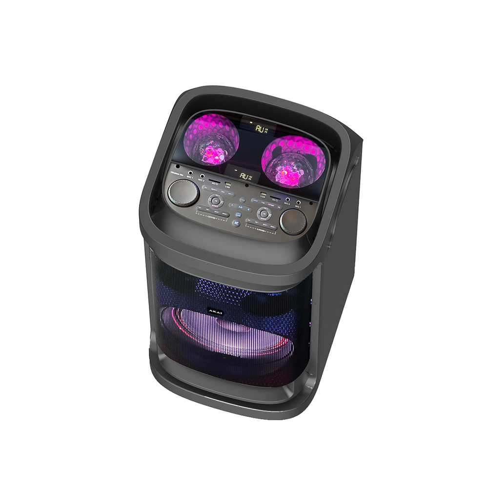 Ciemnoszary głośnik z ekranem wyświetlającym różowe kule, przyciski i siatkową osłonę głośnika. Widoczna jest marka AKAI.