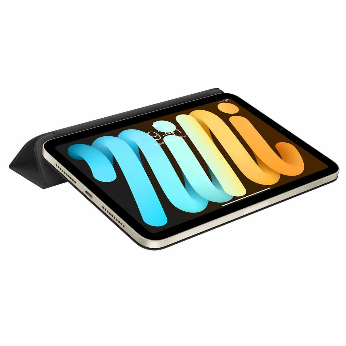 iPad Mini z kolorowym wzorem fali na ekranie, w czarnym etui, na białym tle.