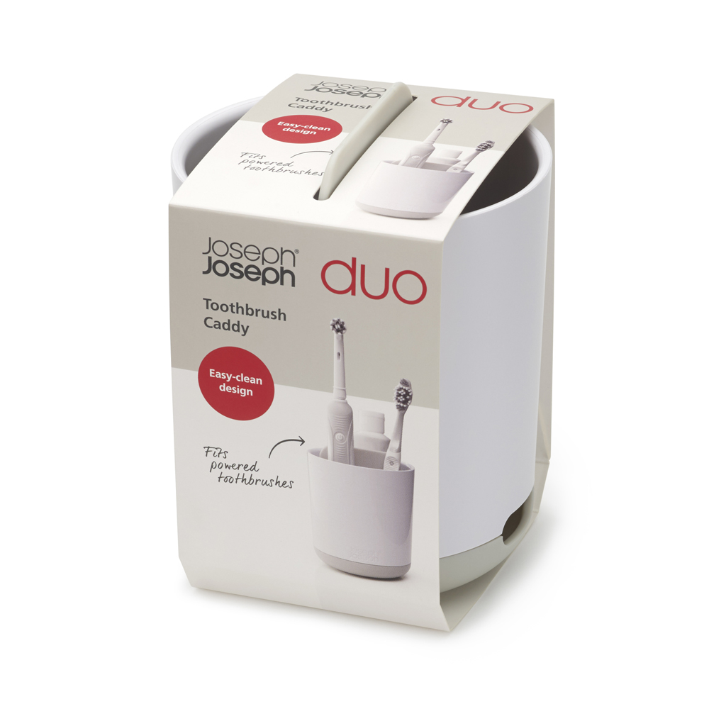 Un porta cepillos de dientes blanco y gris, con la etiqueta 'Joseph Joseph Duo Toothbrush Caddy'. Contiene cepillos de dientes.