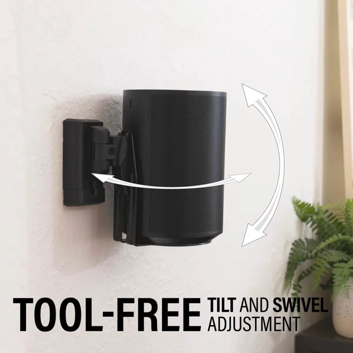 A black speaker mounted on a wall bracket. Arrows indicate tilt and swivel adjustment. Text reads TOOL-FREE TILT AND SWIVEL ADJUSTMENT.