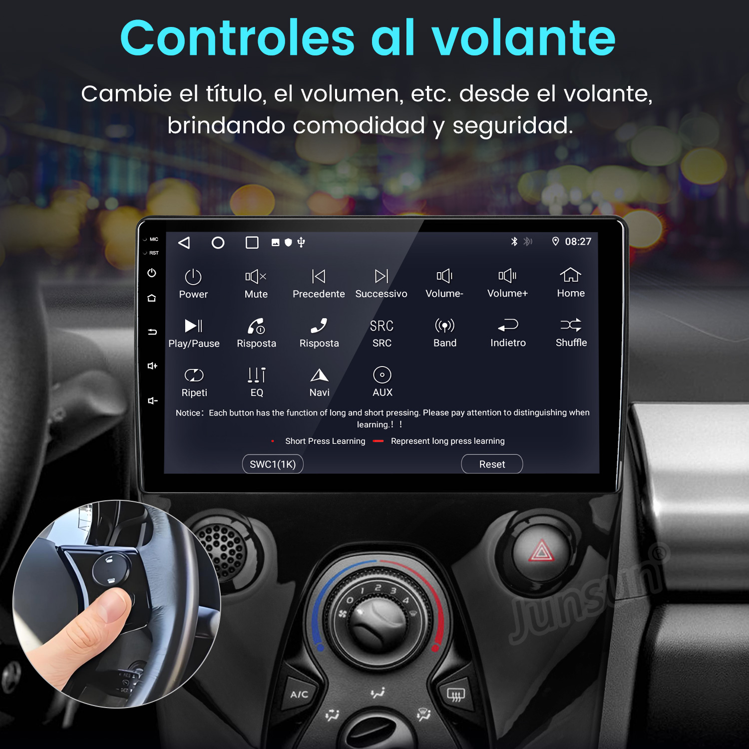 Panel del coche con pantalla táctil. Mano en el volante con controles. Botones de volumen, silencio y navegación visibles.