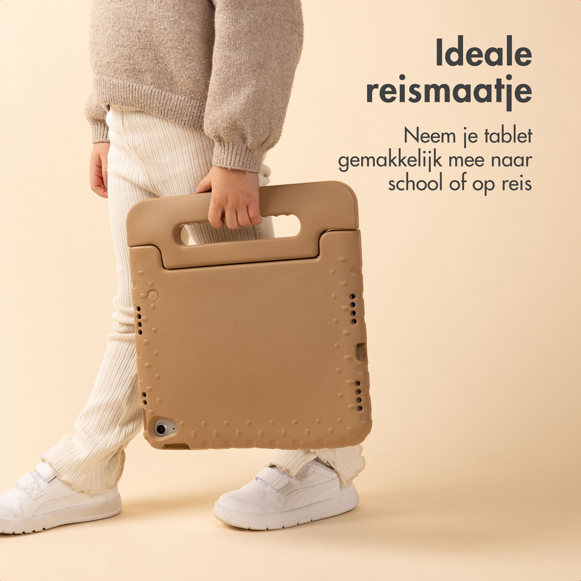 A child holds a brown tablet case. The child wears a beige sweater and white pants and shoes. Text says 'Ideal travel buddy'.