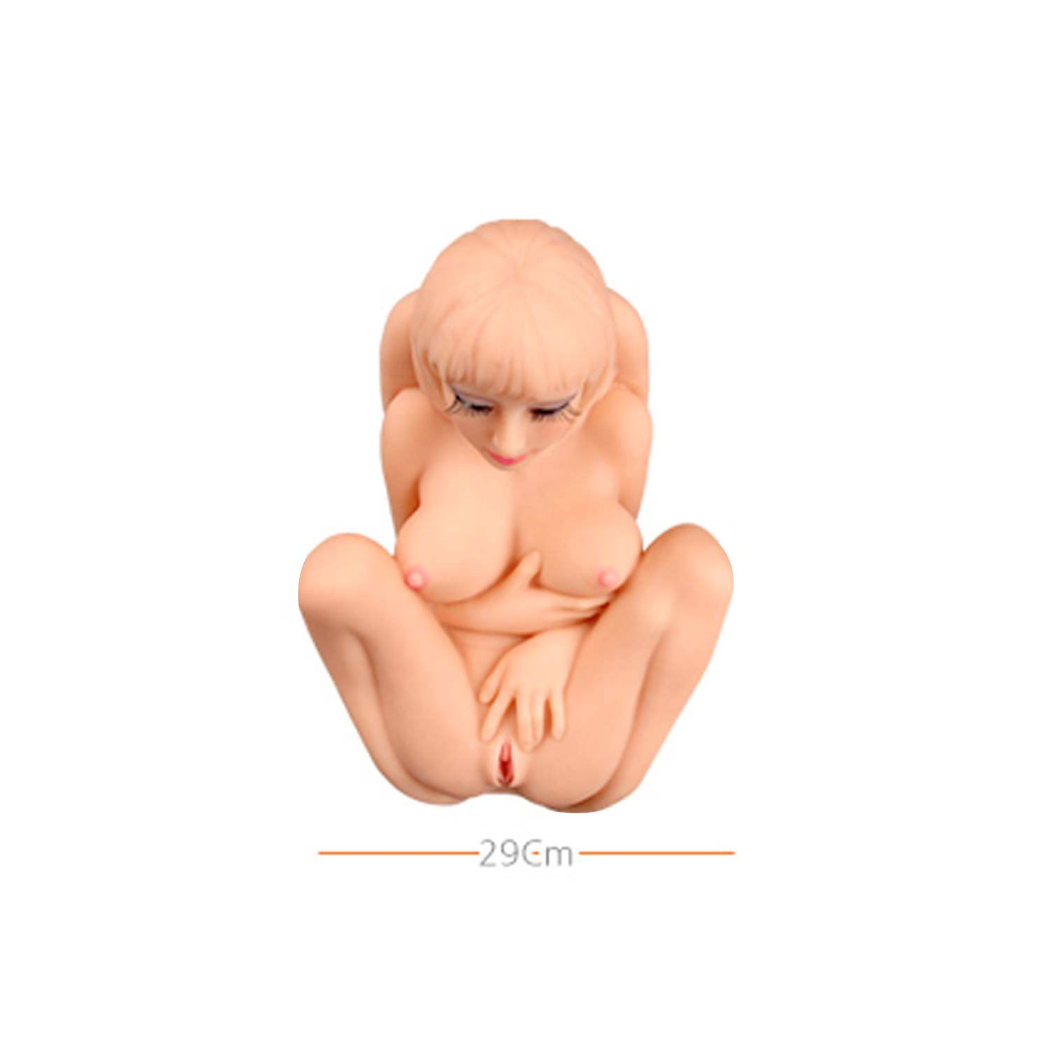 Eine nackte weibliche Puppe sitzt mit angewinkelten Beinen. Die Puppe hat blondes Haar und darunter befindet sich ein Messbalken.