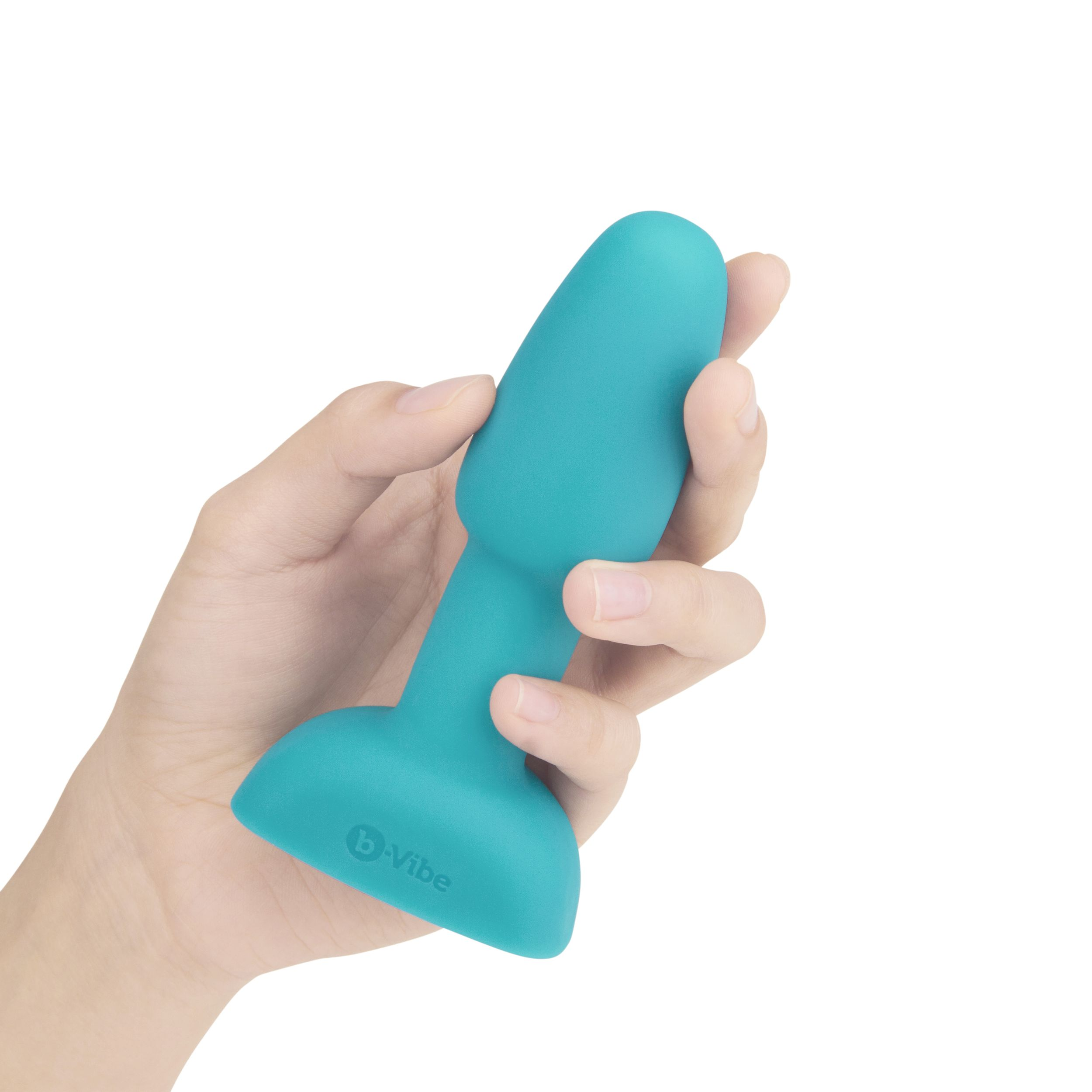 Eine Hand hält einen türkisfarbenen Vibrator. Das Produkt befindet sich vor einem weißen Hintergrund.