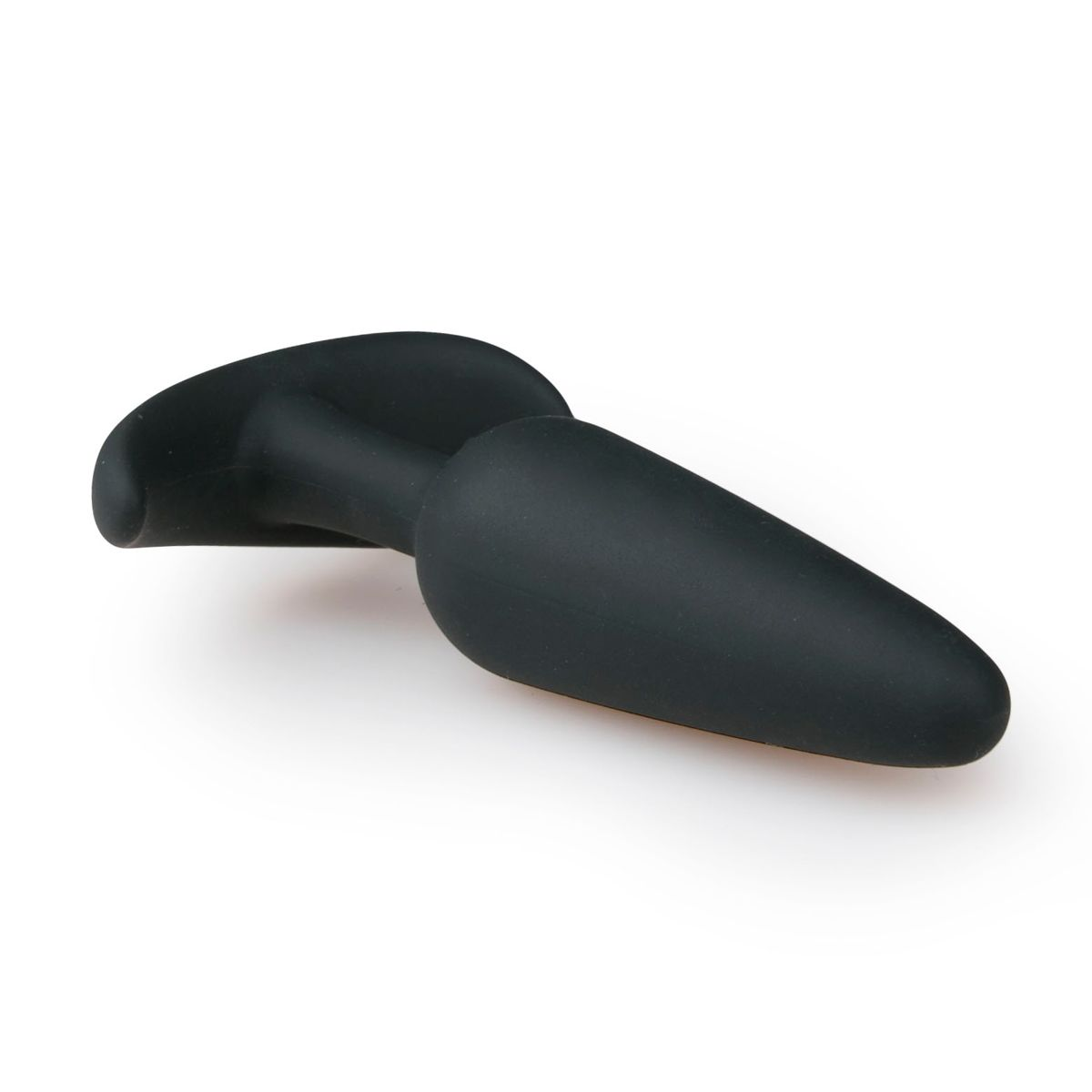 Ein schwarzer, glatter Anus-Plug liegt auf einer weißen Oberfläche. Er hat eine abgerundete Basis und einen sich verjüngenden, länglichen Körper.