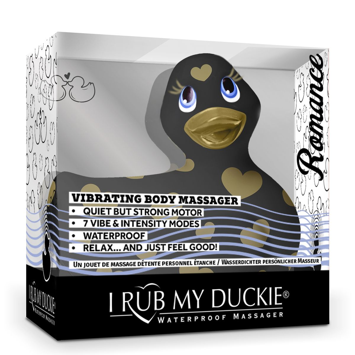 Ein schwarzer Quietschenten-Vibrator in einer Box. Es hat goldfarbene herzförmige Punkte und einen goldenen Schnabel. Text: 'I Rub My Duckie'.
