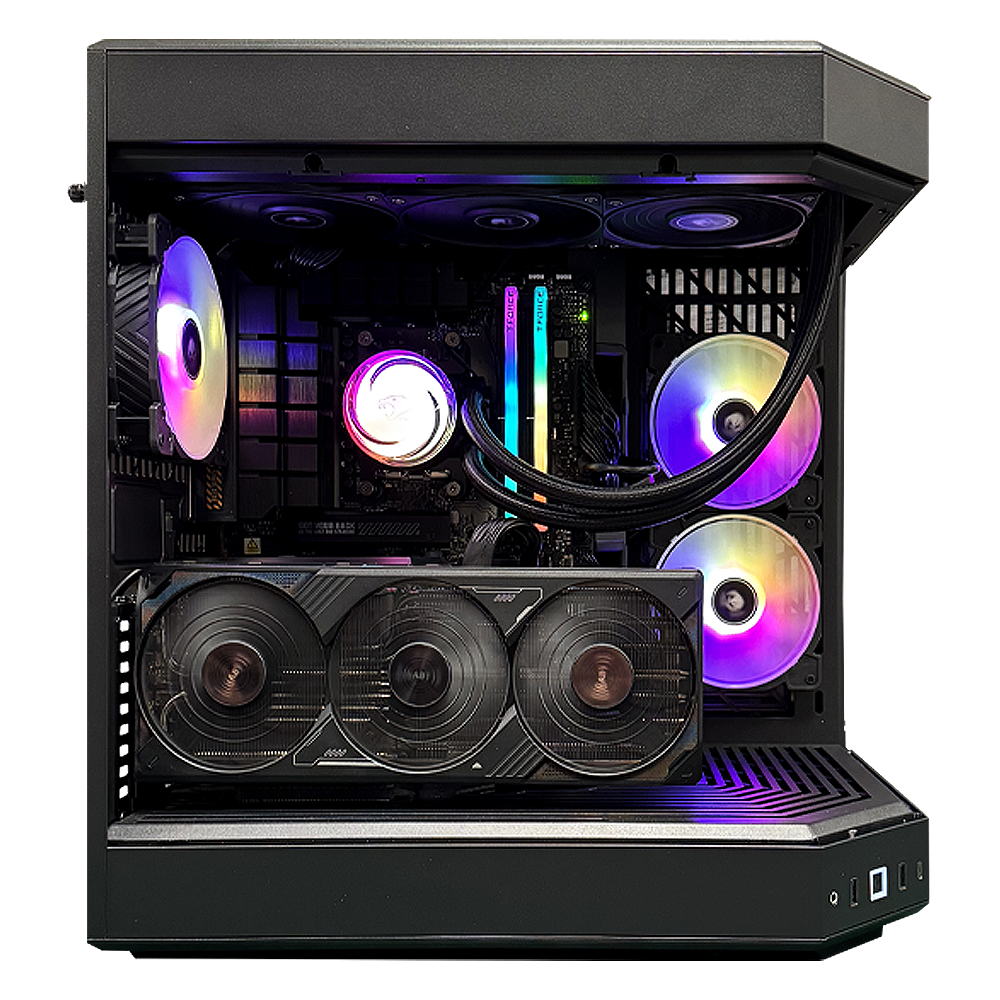Dentro de una caja de ordenador negra, los componentes brillan con luces de colores. El enfoque está en una gran tarjeta gráfica y múltiples ventiladores.