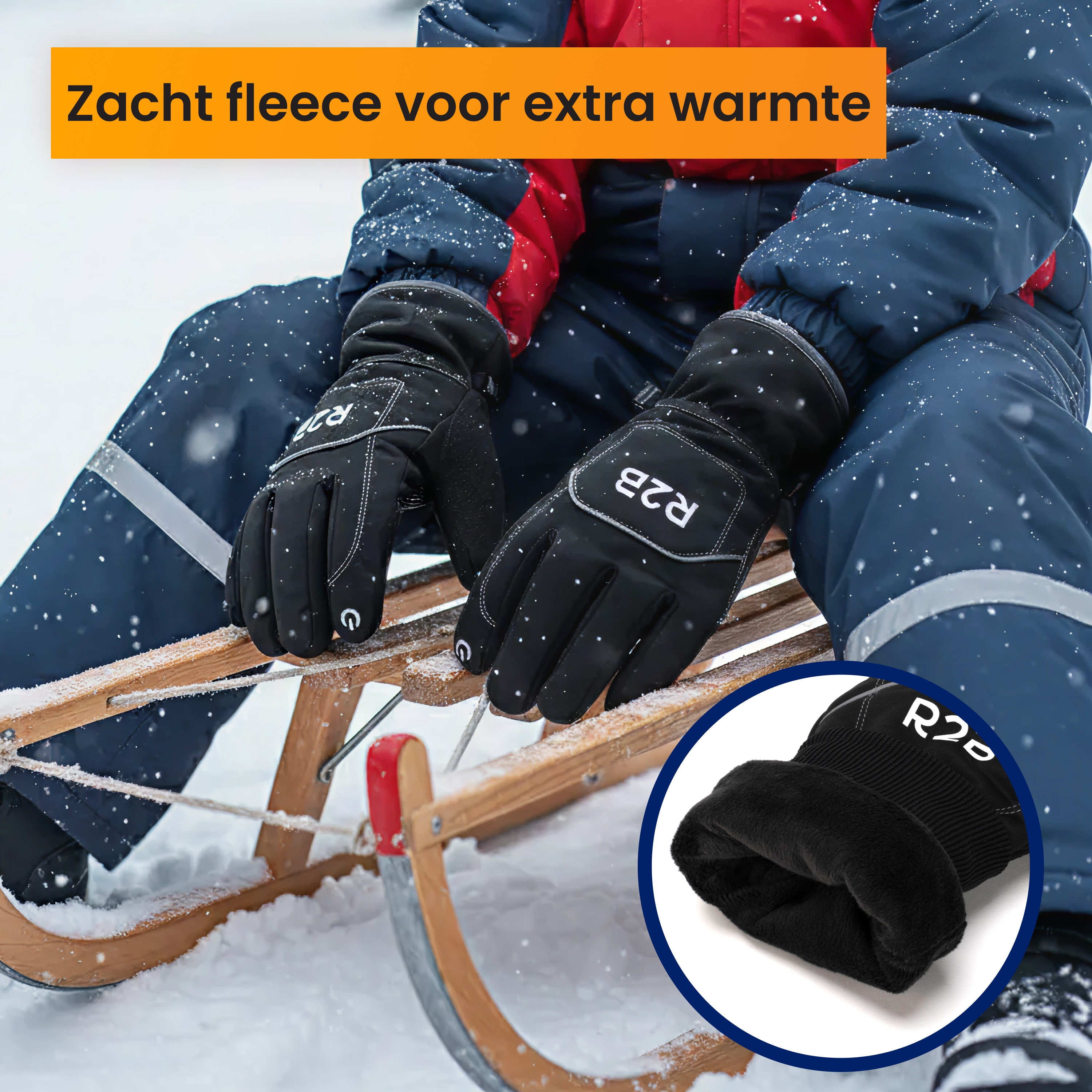 Person wearing black gloves on a wooden sled in the snow. White text on gloves. Snowflakes in the air. Warm fleece.