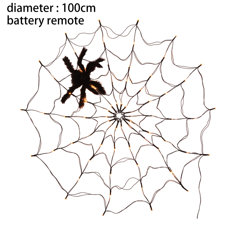 Ein Spinnennetz mit einer schwarzen Spinne, das Netz hat kleine Lichter. Es ist vor weißem Hintergrund.