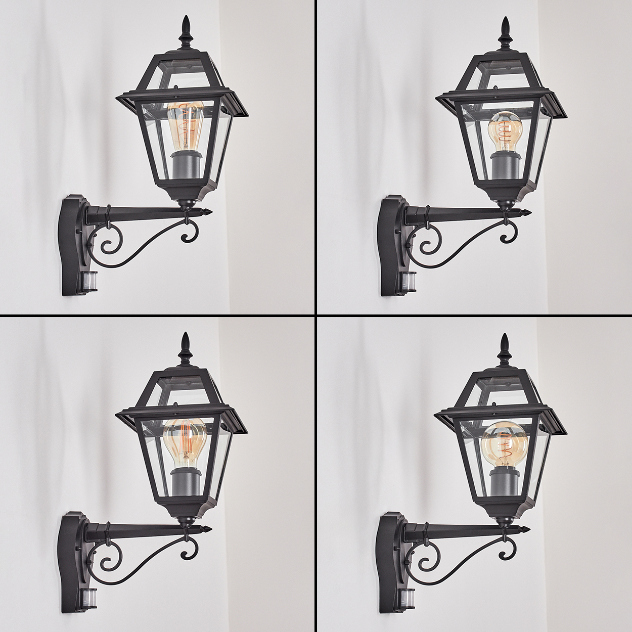Vier schwarze Außenlampen mit Glas und Edison-Glühbirnen an einer weißen Wand. Jede hat einen Bewegungssensor.