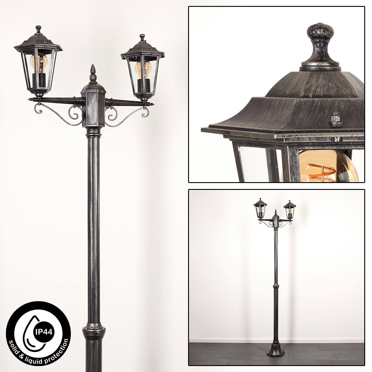 Eine schwarze Außenlampe mit zwei Lichtern, Glasscheiben und einem dekorativen Aufsatz. Ein Symbol für Feststoff- und Flüssigkeitsschutz ist sichtbar.