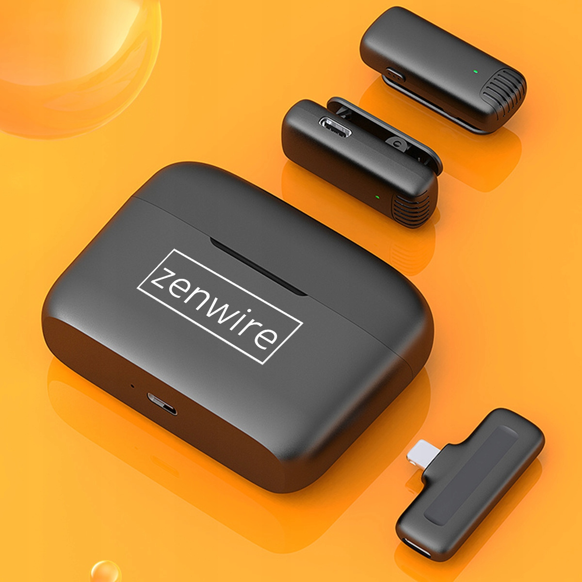 Czarny futerał ładujący Zenwire i zestaw mikrofonów bezprzewodowych na pomarańczowym tle. Zawiera odbiorniki i adapter USB-C.