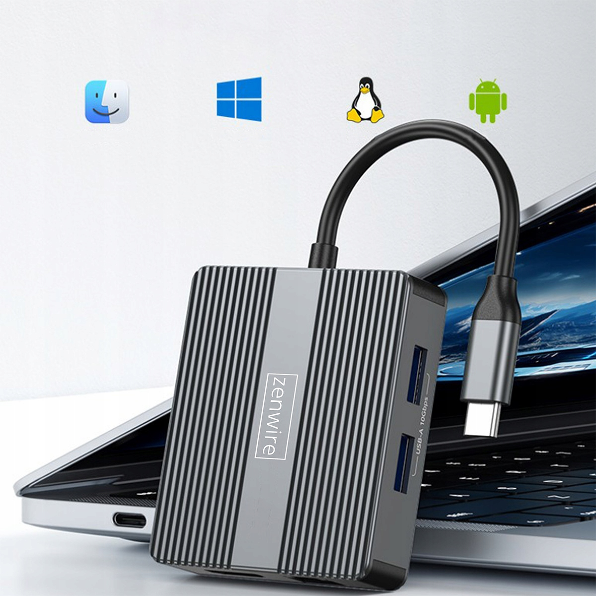 Szary hub USB z marką 'zenwire'. Jest podłączony do laptopa. Ikony Mac, Windows, Linux i Android w tle.