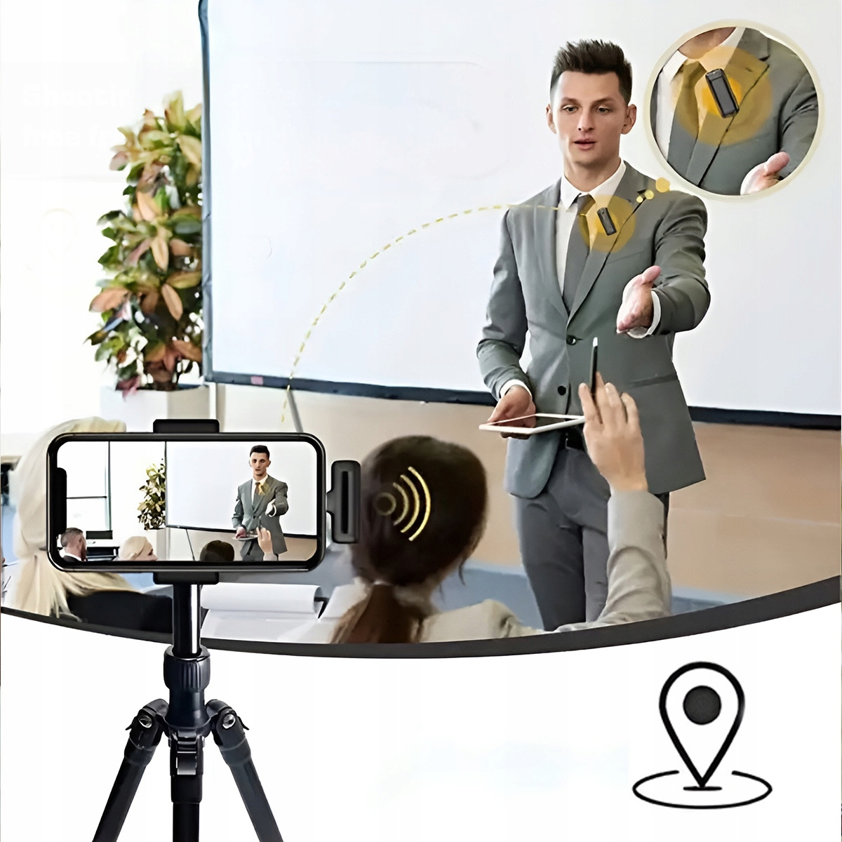 Mężczyzna w garniturze prezentuje. Telefon go nagrywa. Mikrofon jest przymocowany do klapy. Członkowie publiczności oglądają prezentację.