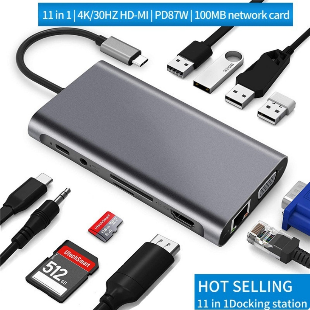 Eine graue 11-in-1-Dockingstation mit mehreren Anschlüssen und angeschlossenen Geräten, einschließlich USB-Laufwerken und SD-Karten. Text: HOT SELLING.