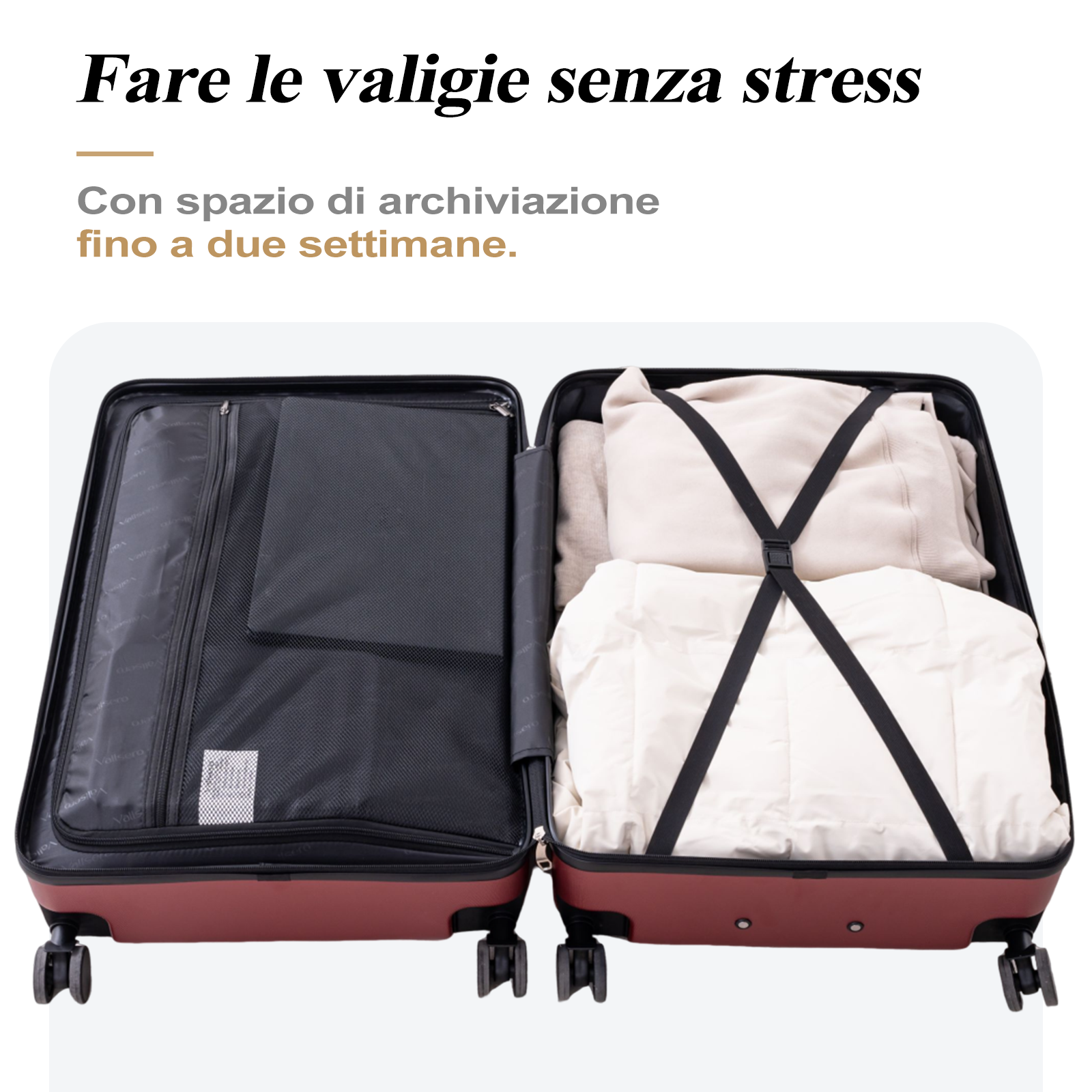 Valigia aperta con vestiti, un scomparto nero e cinghie. La valigia è bordeaux.