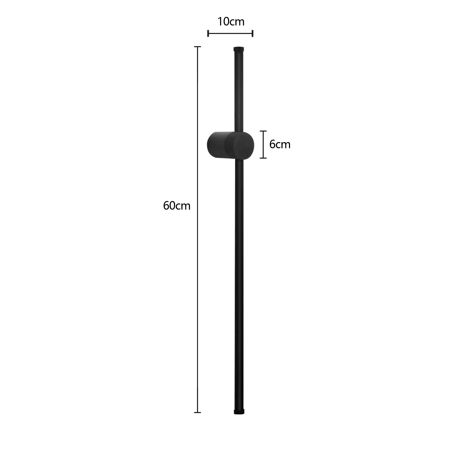 Un apparecchio a parete verticale nero. È alto 60 cm con una parte superiore di 10 cm di larghezza e una sezione centrale circolare di 6 cm.