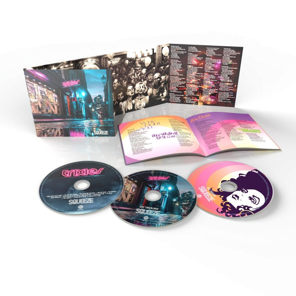 Set CD: tre dischi, libretto aperto con testi e copertina con scena cittadina e nome della band.
