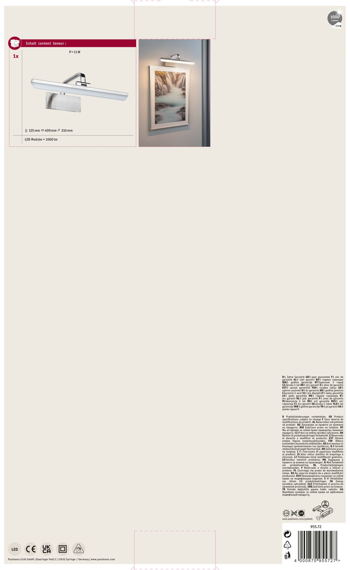 Nowoczesna, srebrna lampa nad oprawionym zdjęciem wodospadu.