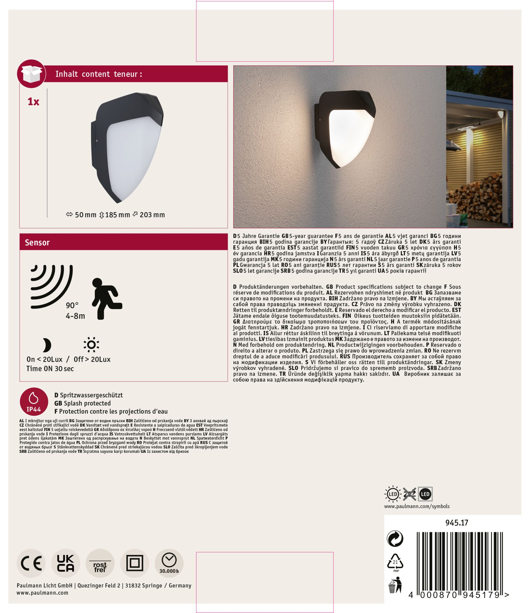 Biało-czarna lampa zewnętrzna, z czujnikiem i symbolami oraz tekstem w wielu językach.