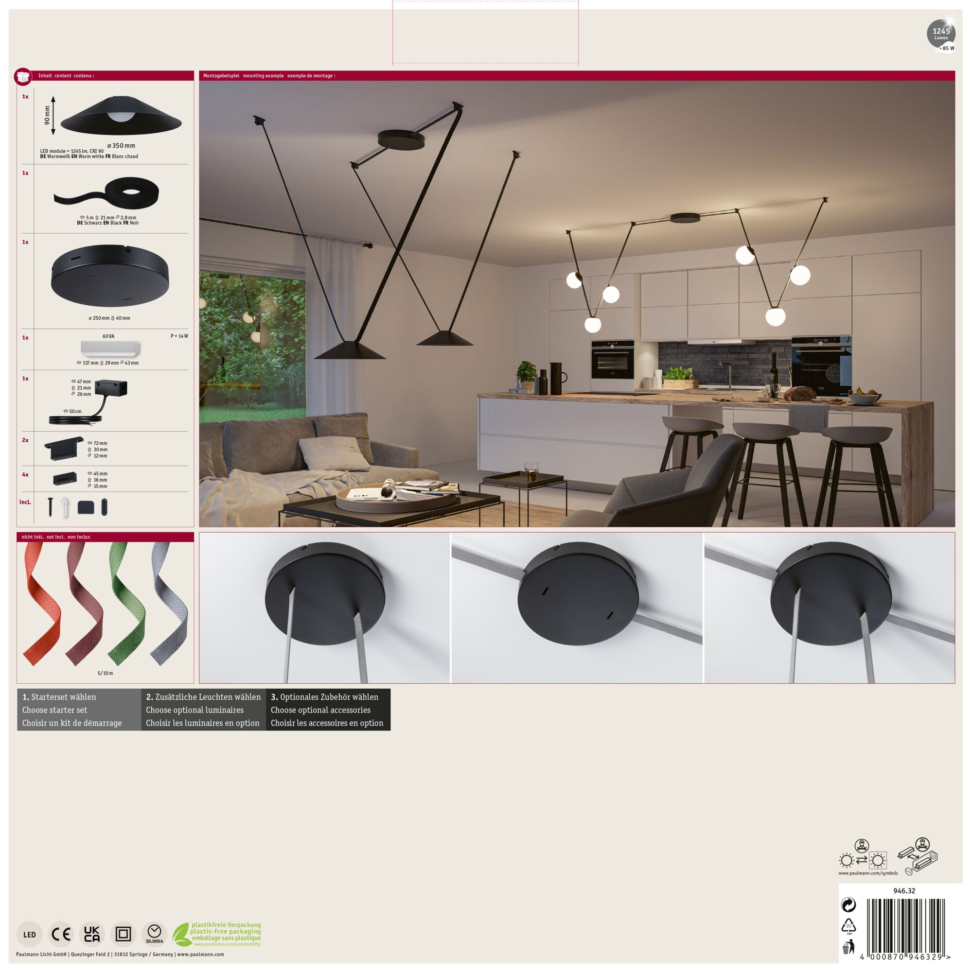 L'immagine mostra un moderno sistema di illuminazione con lampade nere e una cucina sullo sfondo.