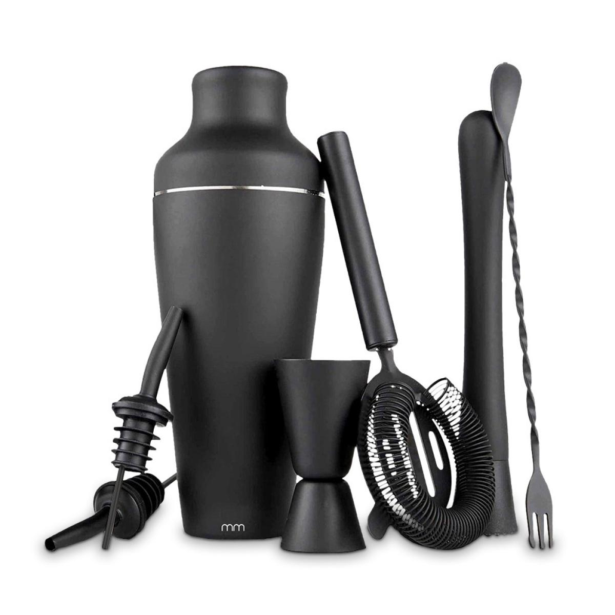 A set of black bar tools. Includes a shaker, strainer, jigger, spoon, muddler, and a pour spout, all on a white background.