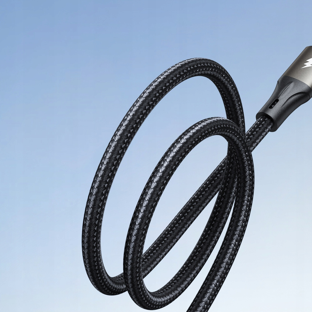 A close-up of a black braided charging cable, looping against a gradient blue background.