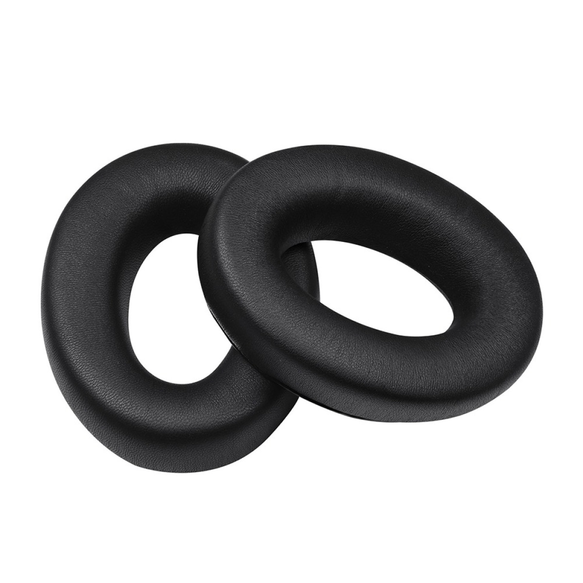 Due cuscinetti auricolari neri per cuffie, a forma ovale con un foro al centro, su sfondo bianco.