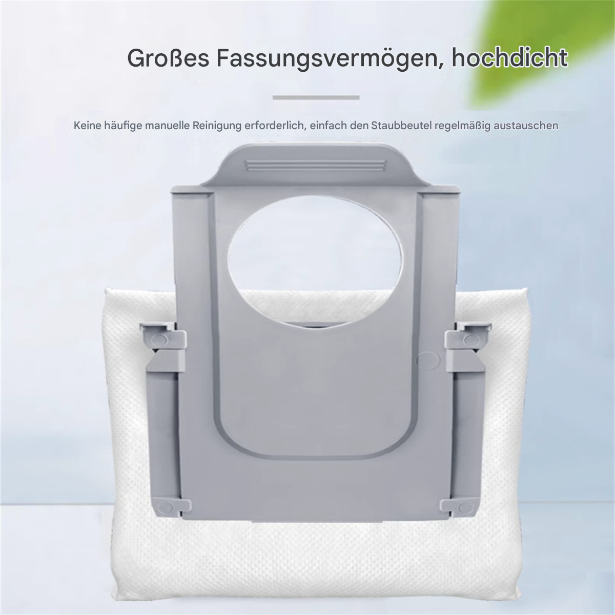 Ein grauer Staubsauger-Staubbeutel mit einem weißen Stoffbeutel im Inneren. Der Text oben lautet 'Große Kapazität, hohe Dichte'.