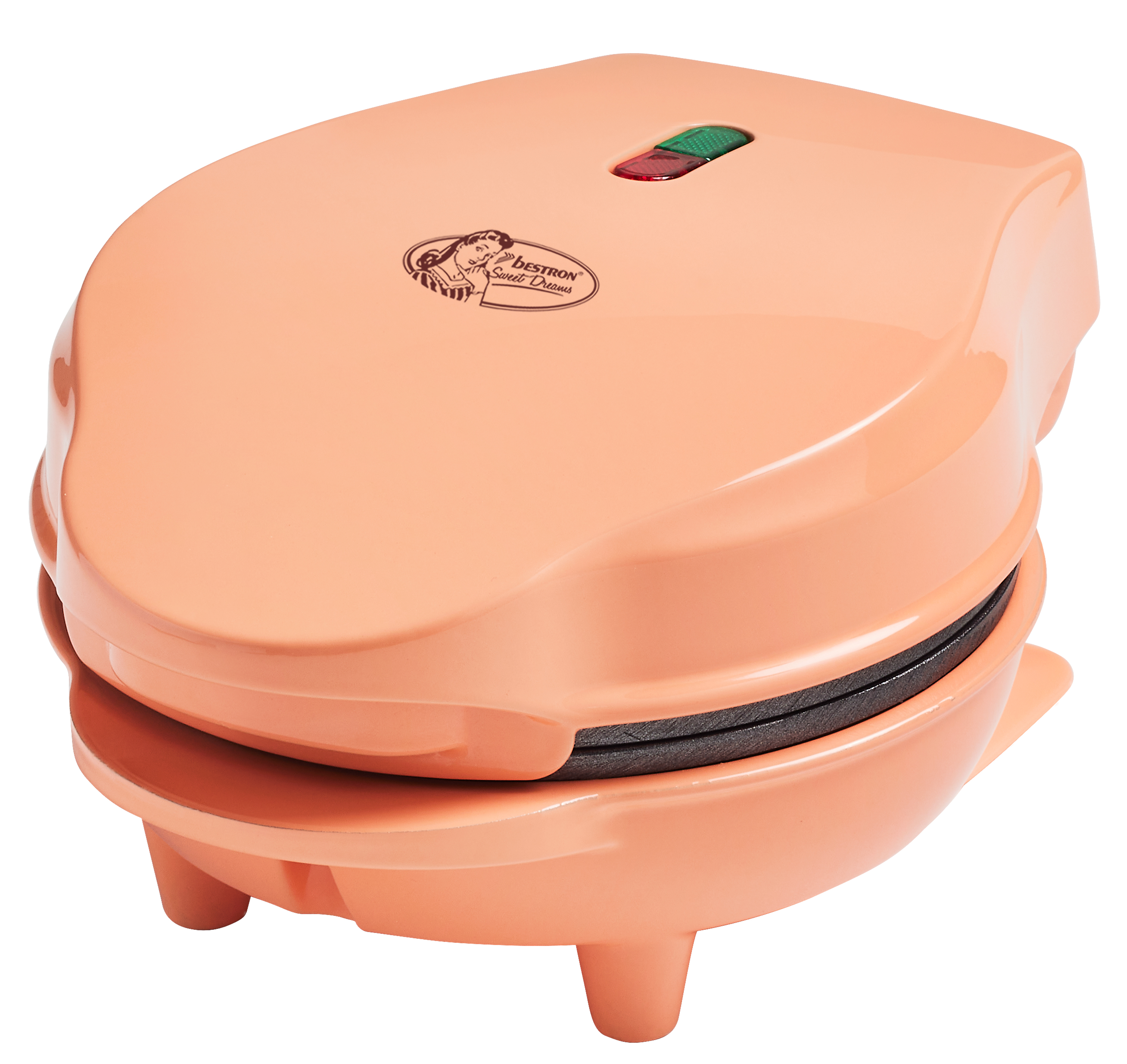 A peach-colored waffle maker with a logo, green and red lights. It has a rounded design and stands on small legs.