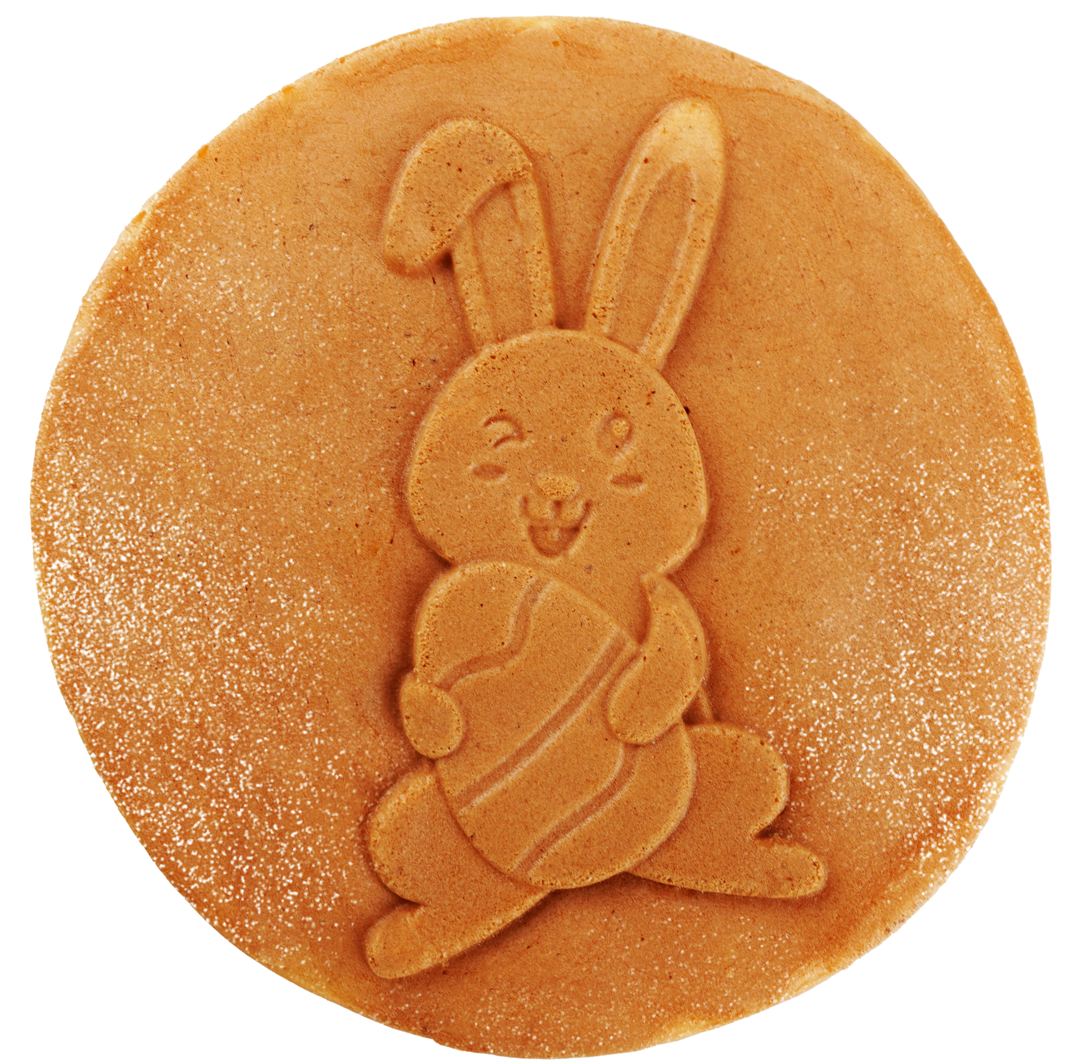 A round, light-brown pancake with a bunny holding an egg embossed on it. The background is white.