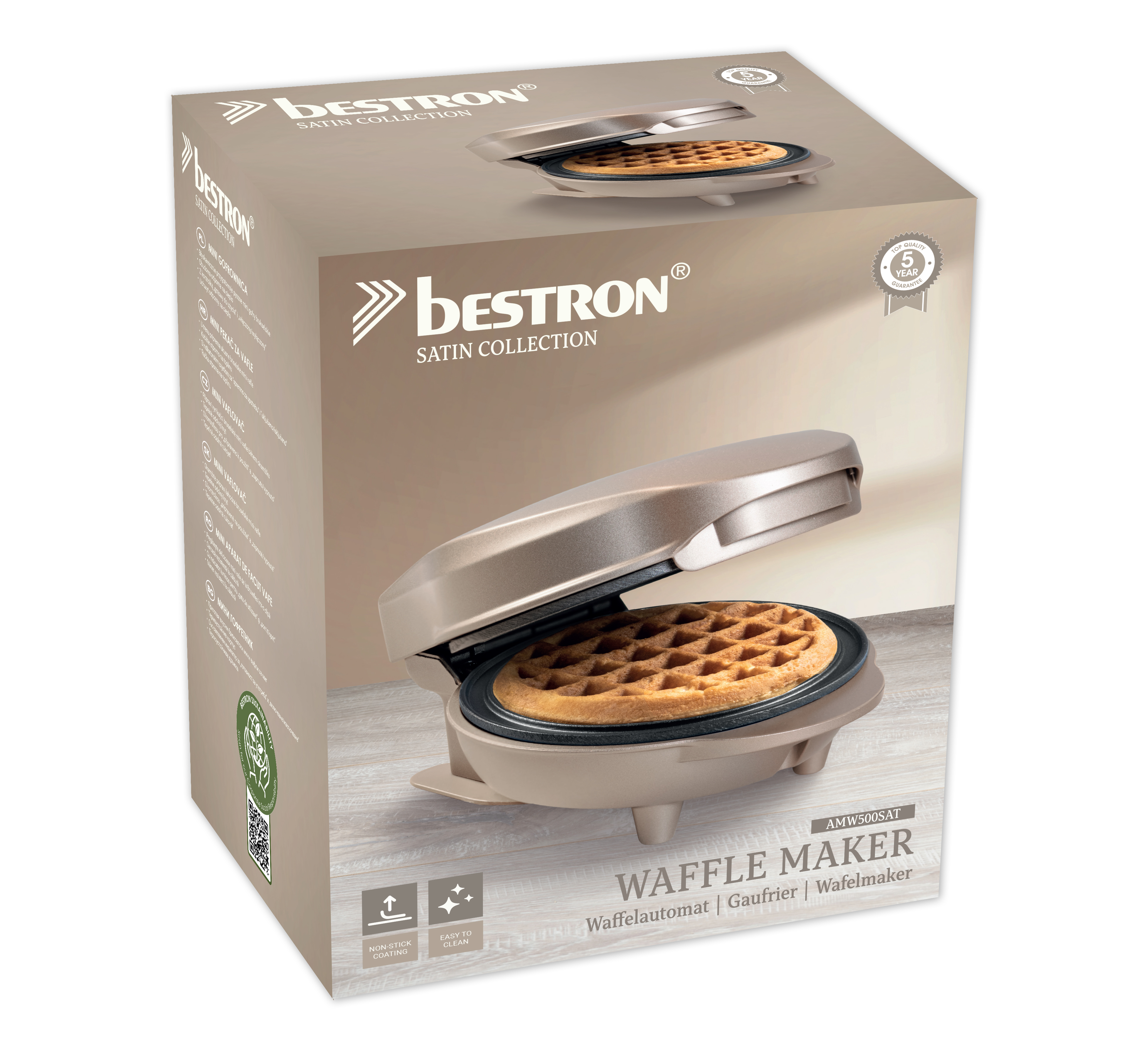 A waffle maker in its box is displayed. The waffle maker is open, showing a cooked waffle. The box has text.