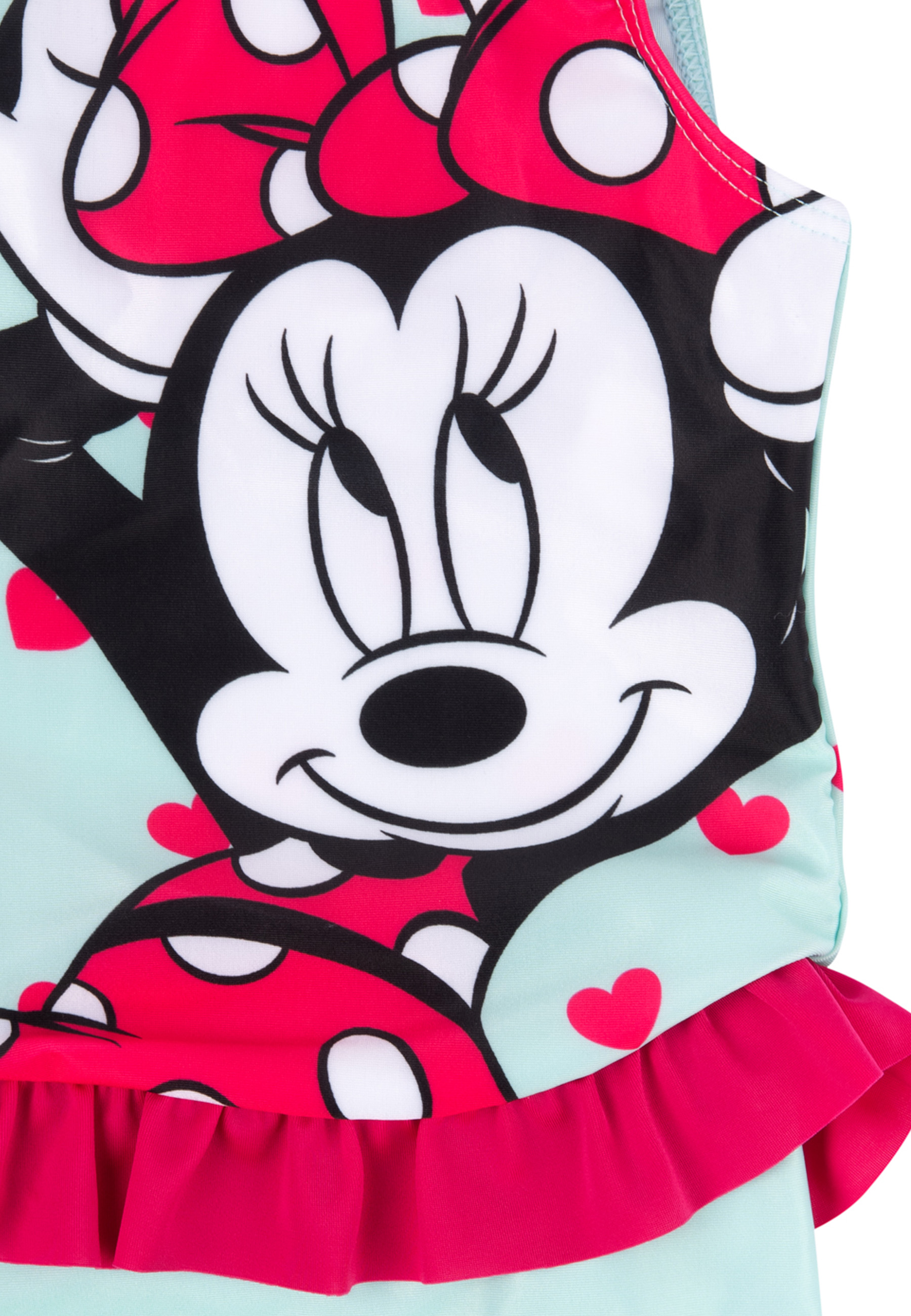 Ein Minnie-Maus-Badeanzug. Er hat Minnies lächelndes Gesicht, eine rote Schleife und eine rosa Rüsche.