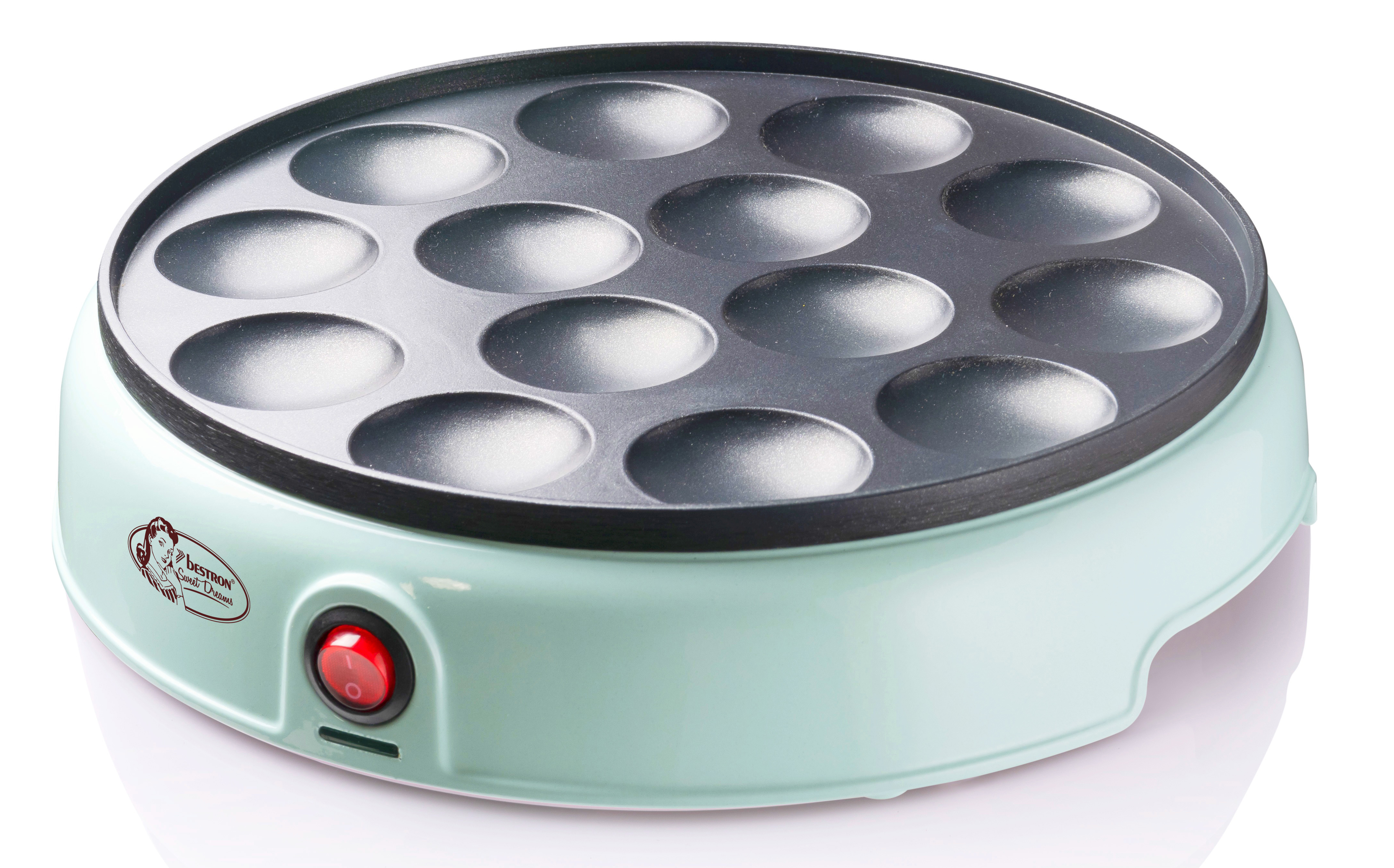 Zielona maszyna do naleśników z okrągłą powierzchnią do gotowania z 12 okrągłymi formami. Posiada czerwony przycisk zasilania.