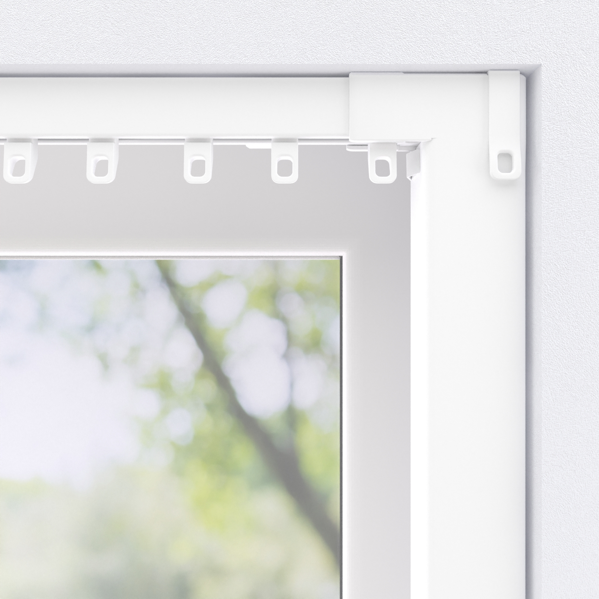 Close-up of a white window frame with a curtain rail and hooks. Background shows blurred green foliage.