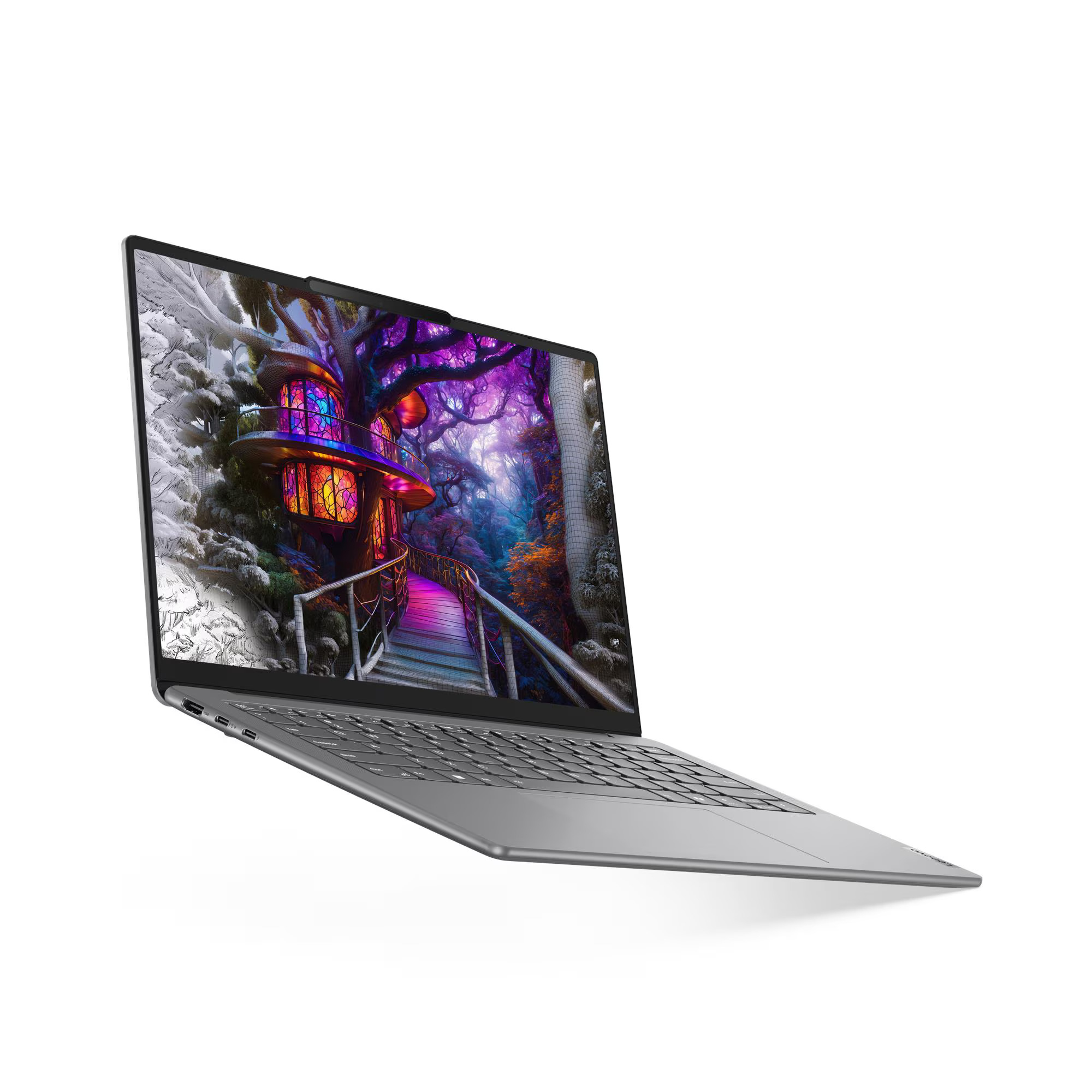 Un laptop mostra una scena fantasy colorata di un ponte e di edifici in una foresta. Il laptop è argentato, angolato su una superficie bianca.
