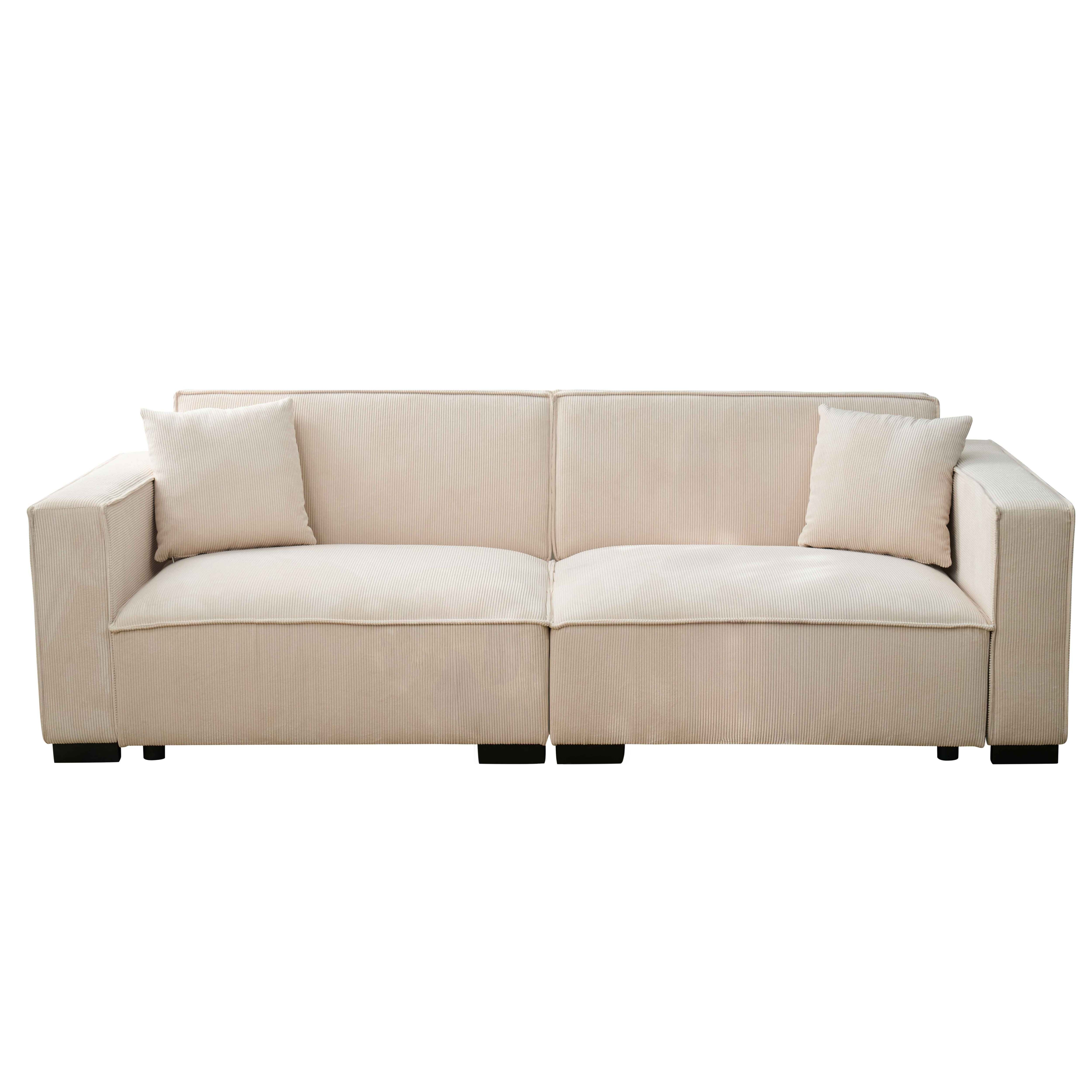 Cremefarbenes Cordsofa mit zwei Kissen. Schwarze Beine stützen das Sofa.