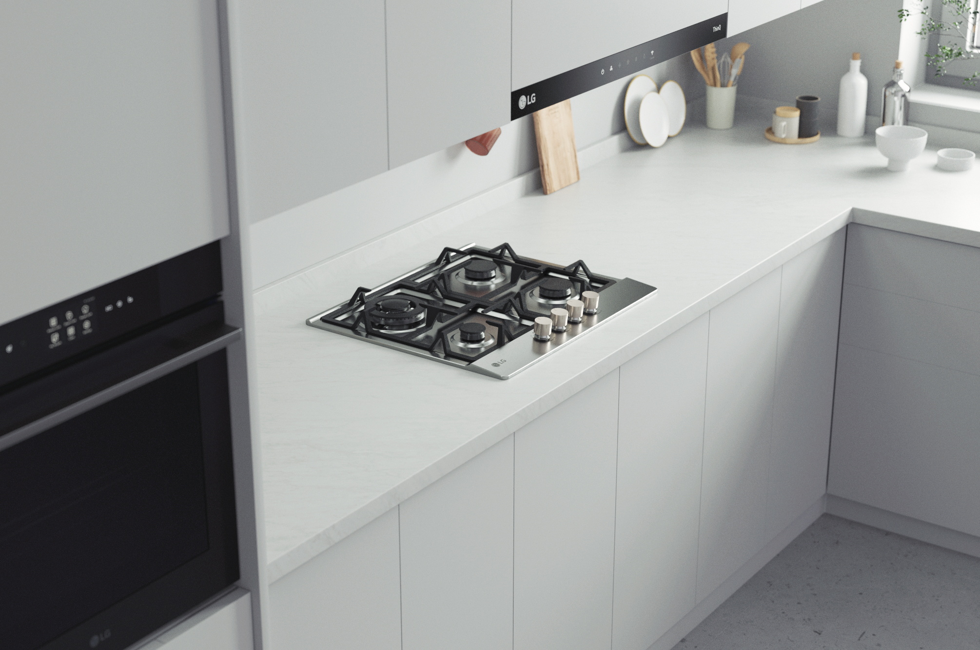 Nowoczesna kuchnia z płytą grzewczą na białym blacie. Jest piekarnik i szafki. Różne przybory kuchenne w tle.