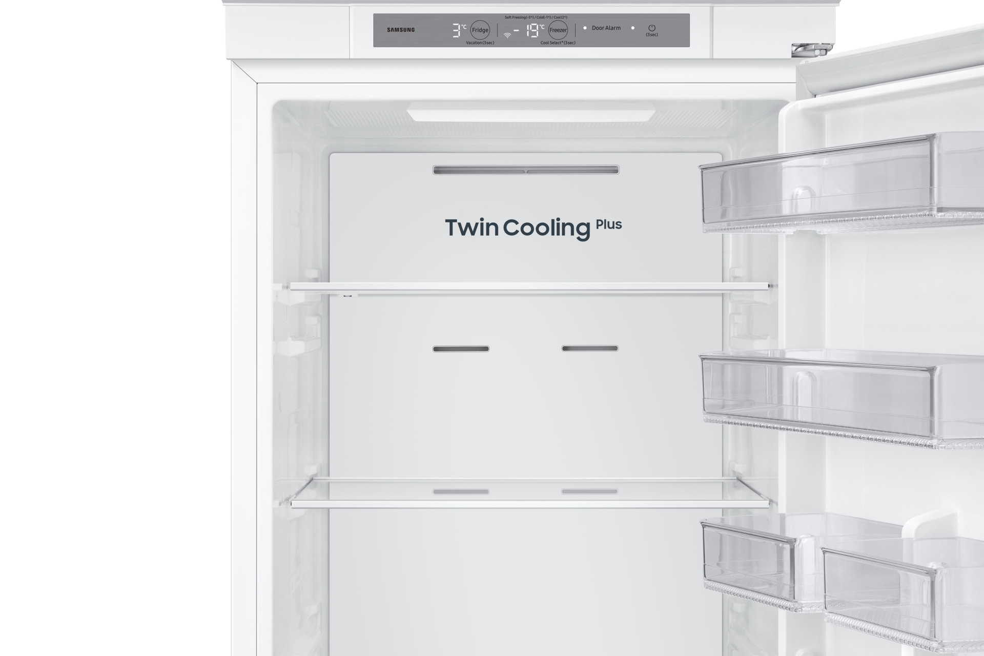 Wnętrze białej lodówki z półkami i szufladami. Górny panel ma markę Samsung i regulatory temperatury.