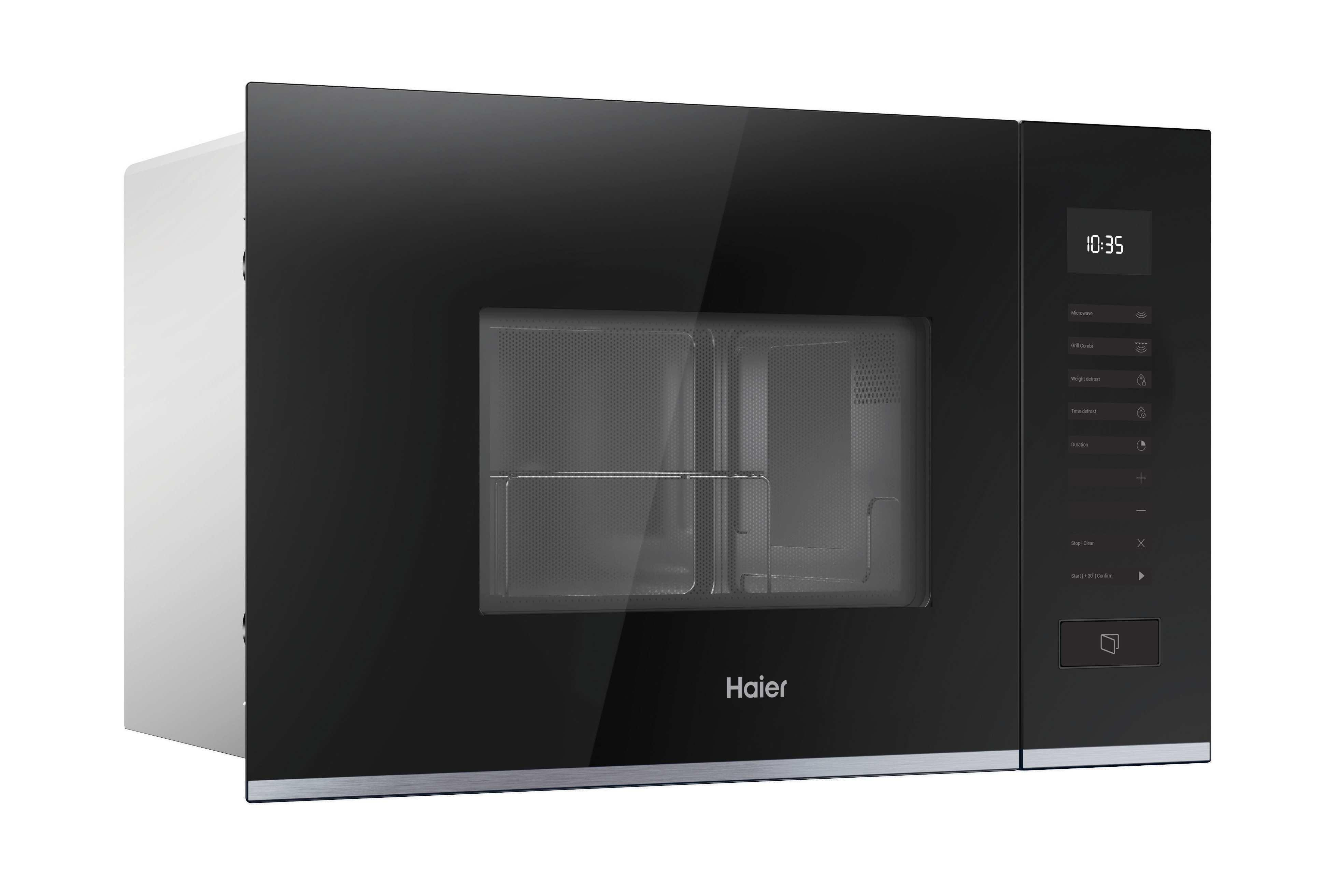 Un microonde Haier nero con display digitale 10:35. Ha un pannello di controllo sul lato destro.