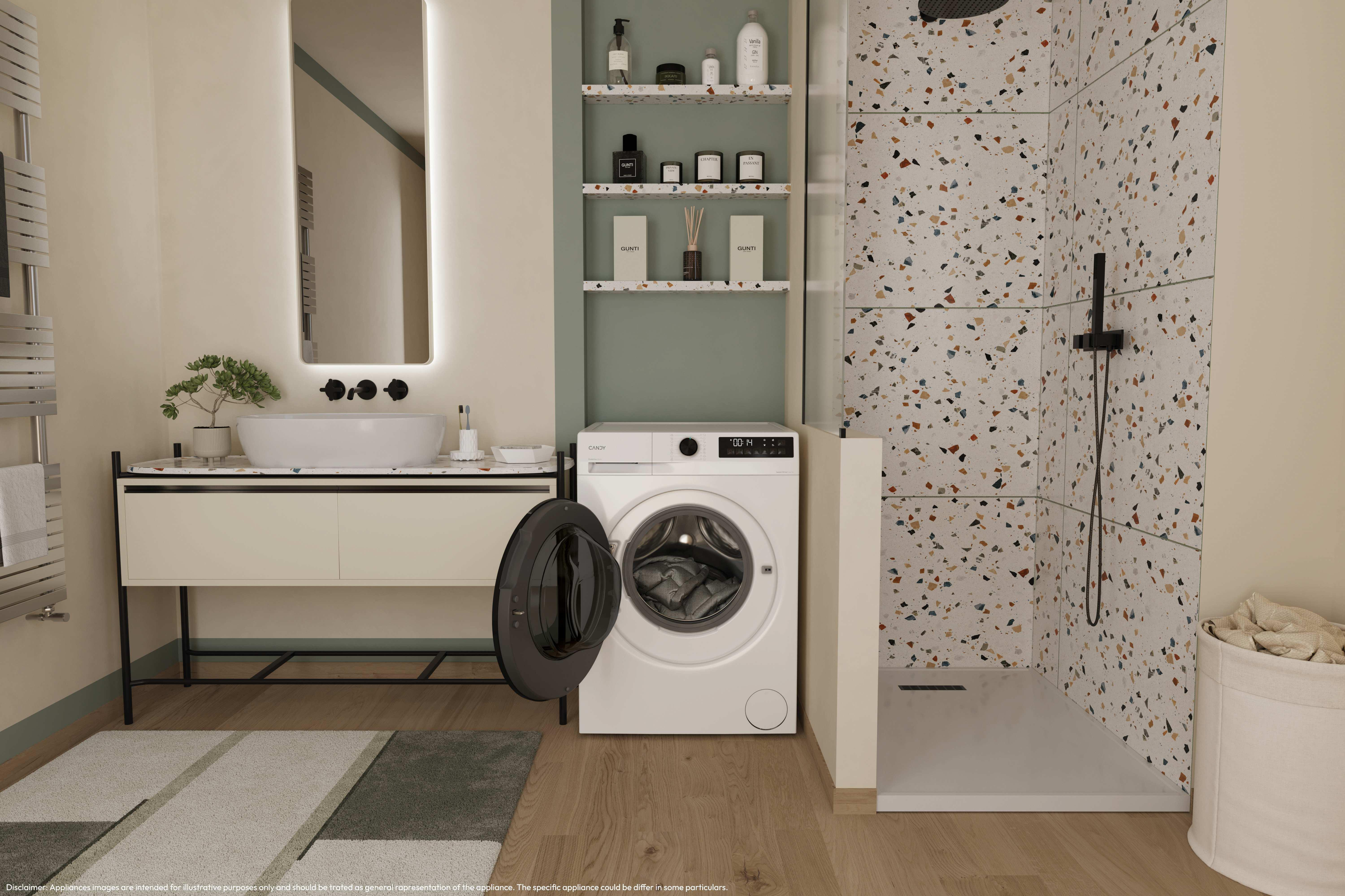 Baño con lavadora, ducha, espejo y lavabo. Se ven baldosas de terrazo y una alfombra.