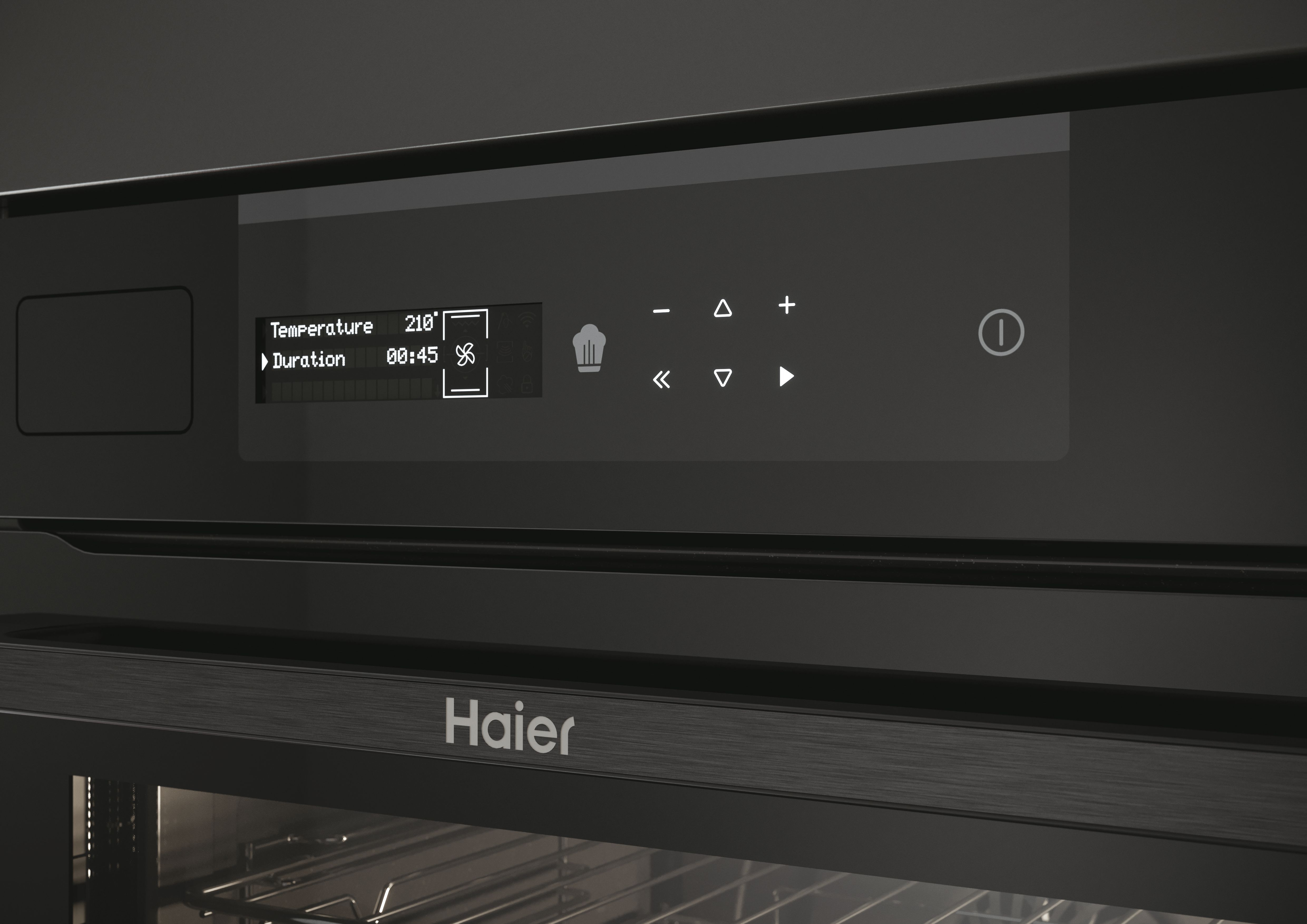 Primer plano del panel de control de un horno negro. Muestra temperatura, duración e iconos de control.