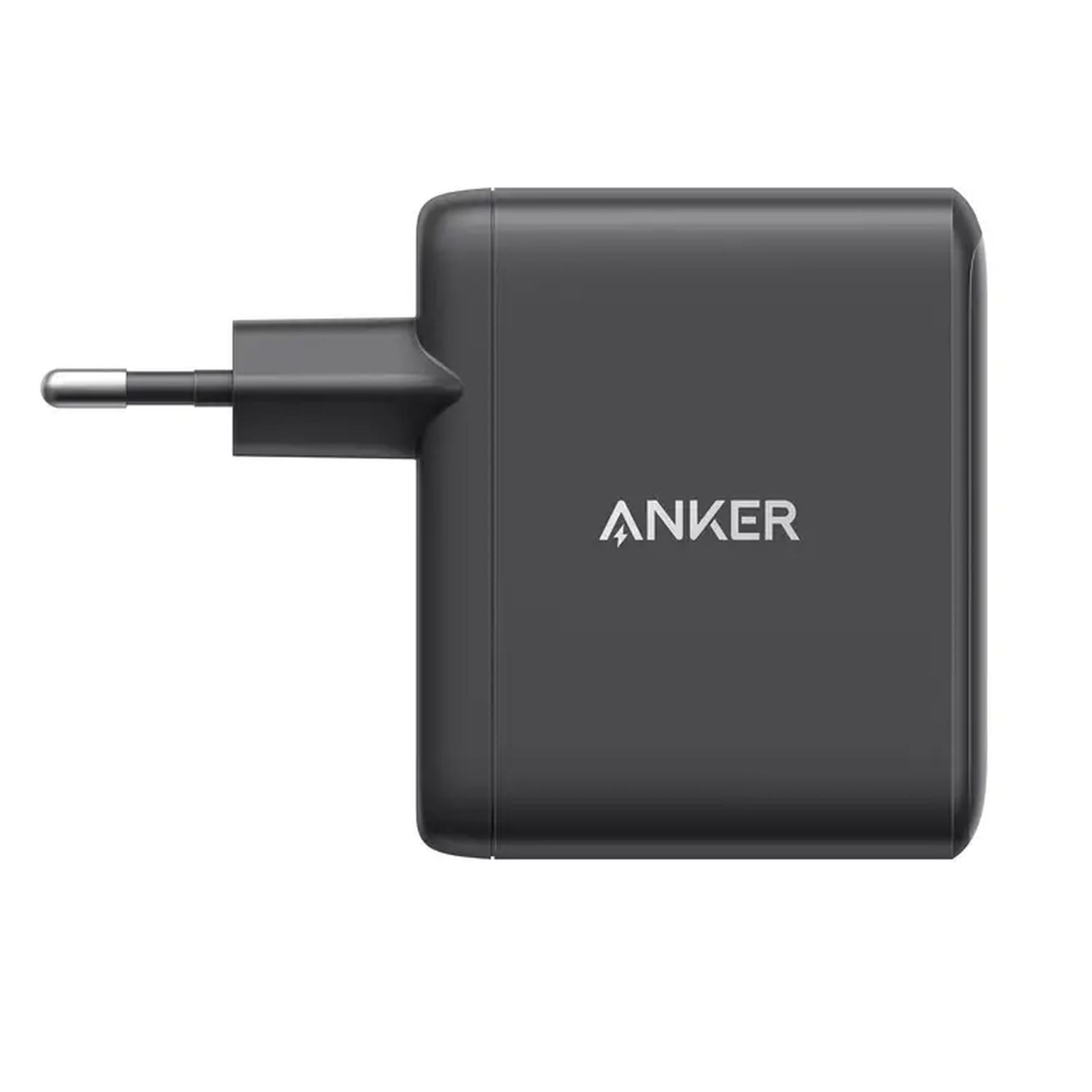 Un cargador Anker gris oscuro con un enchufe de dos clavijas. El logotipo de Anker está en el frente.