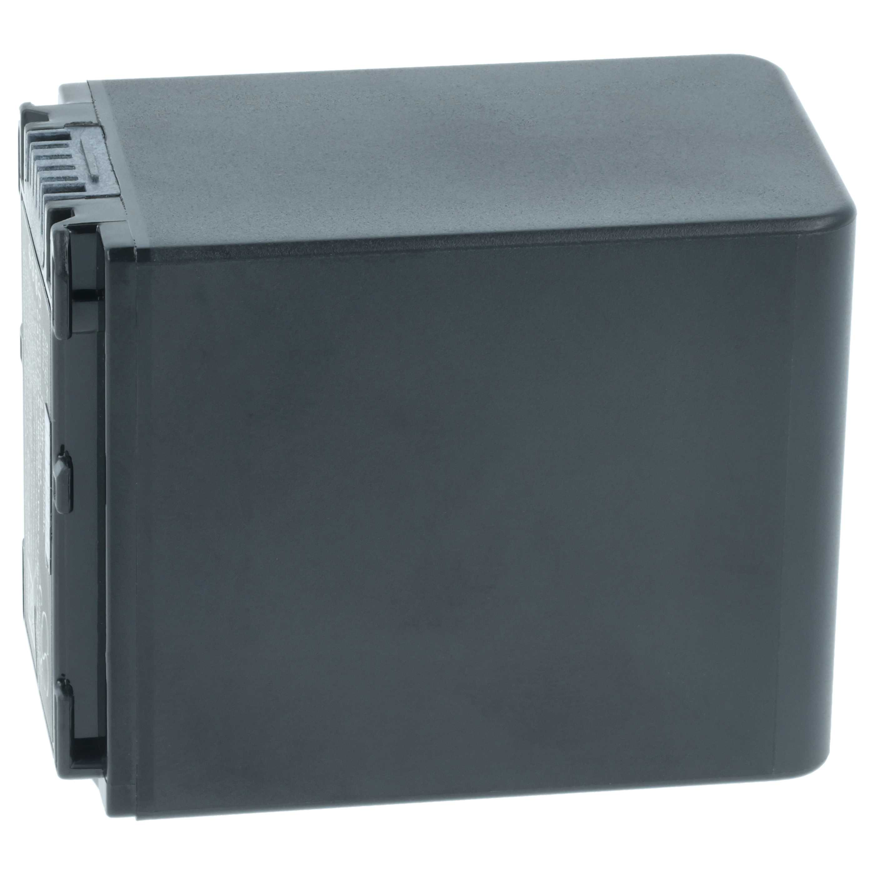 Ein dunkelgraues rechteckiges Objekt, möglicherweise eine Batterie, auf weißem Hintergrund. Es hat einen geriffelten Abschnitt.