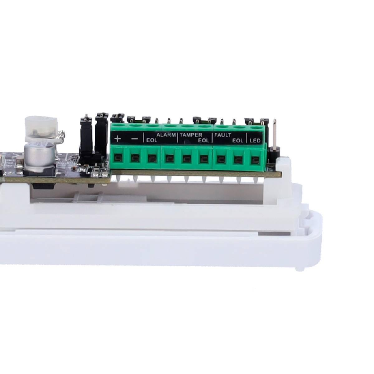 Una placa de circuito con conectores verdes. Las etiquetas incluyen alarma, manipulación, fallo y LED. Una base de plástico blanco soporta la placa.