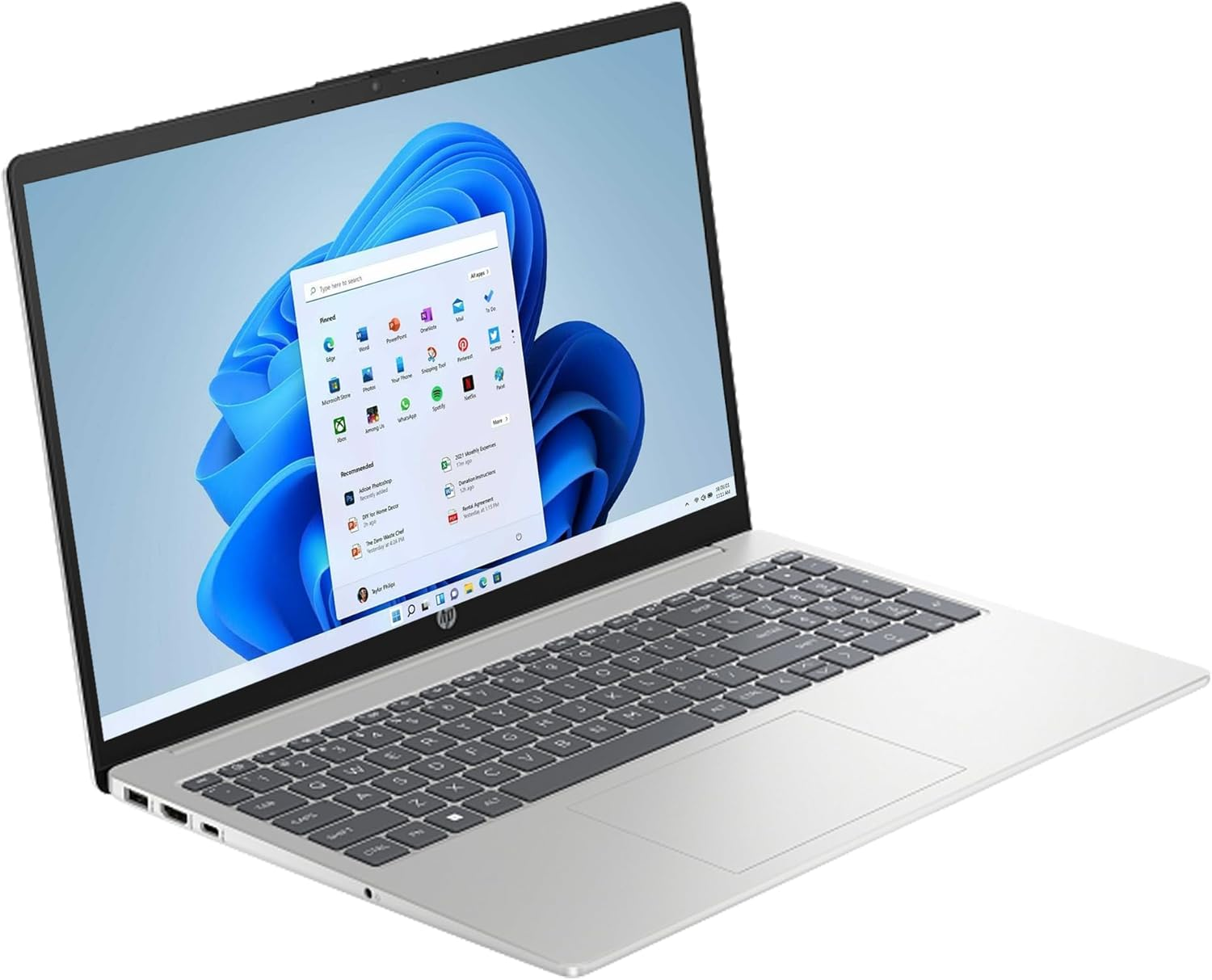 Ein silberner Laptop ist geöffnet und zeigt die Windows 11-Oberfläche. Der Bildschirm zeigt App-Symbole und einen blauen Hintergrund.