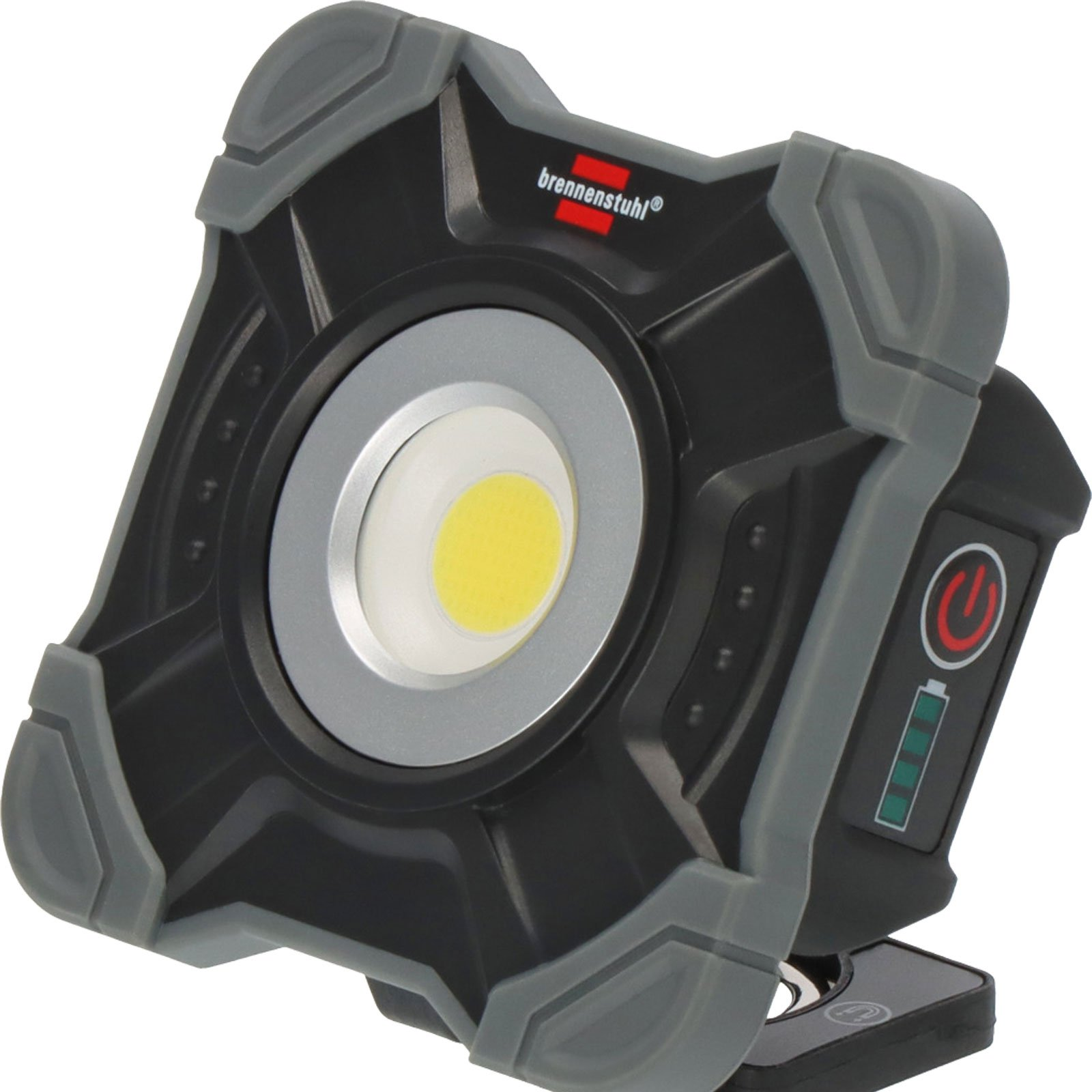 Lampada da lavoro nera e grigia. La luce ha una grande luce circolare, un pulsante di accensione e un indicatore di batteria.