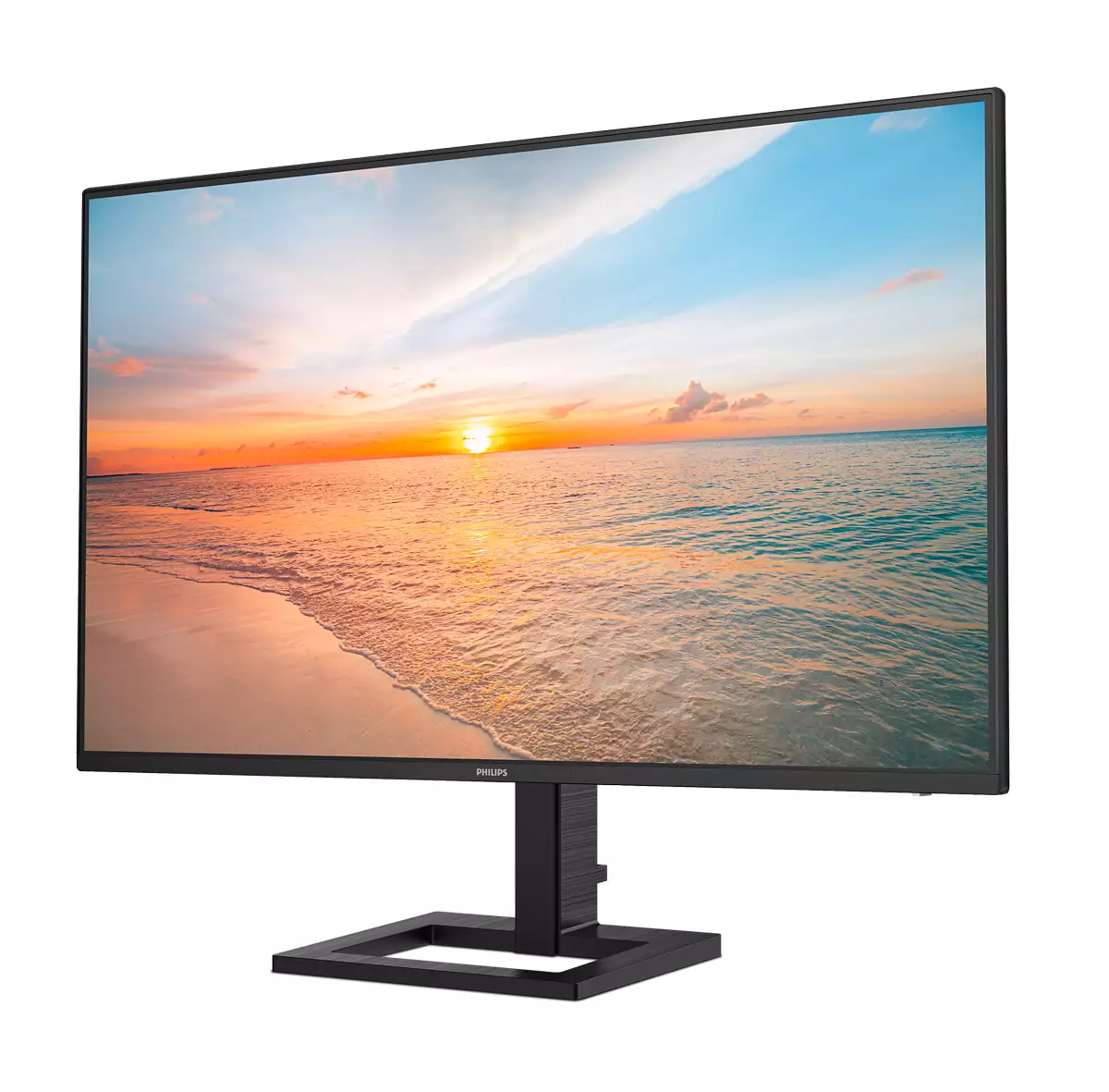 Un monitor Philips mostra un tramonto sulla spiaggia. Il monitor ha una cornice e un supporto neri. Lo schermo mostra il mare, il cielo e la sabbia.