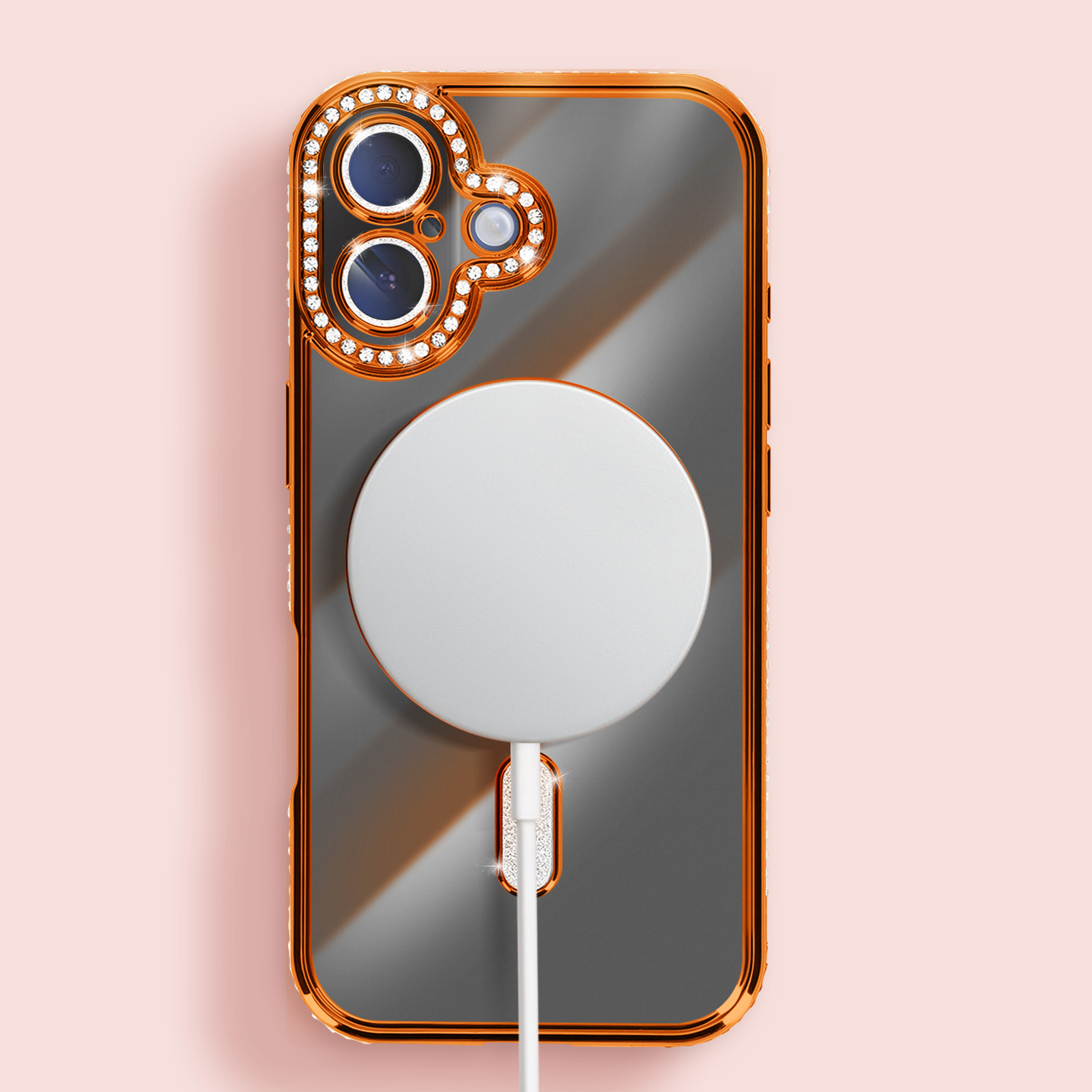 Coque de téléphone avec cadre doré, gemmes et cercle blanc, reliée à un câble blanc, sur fond rose.