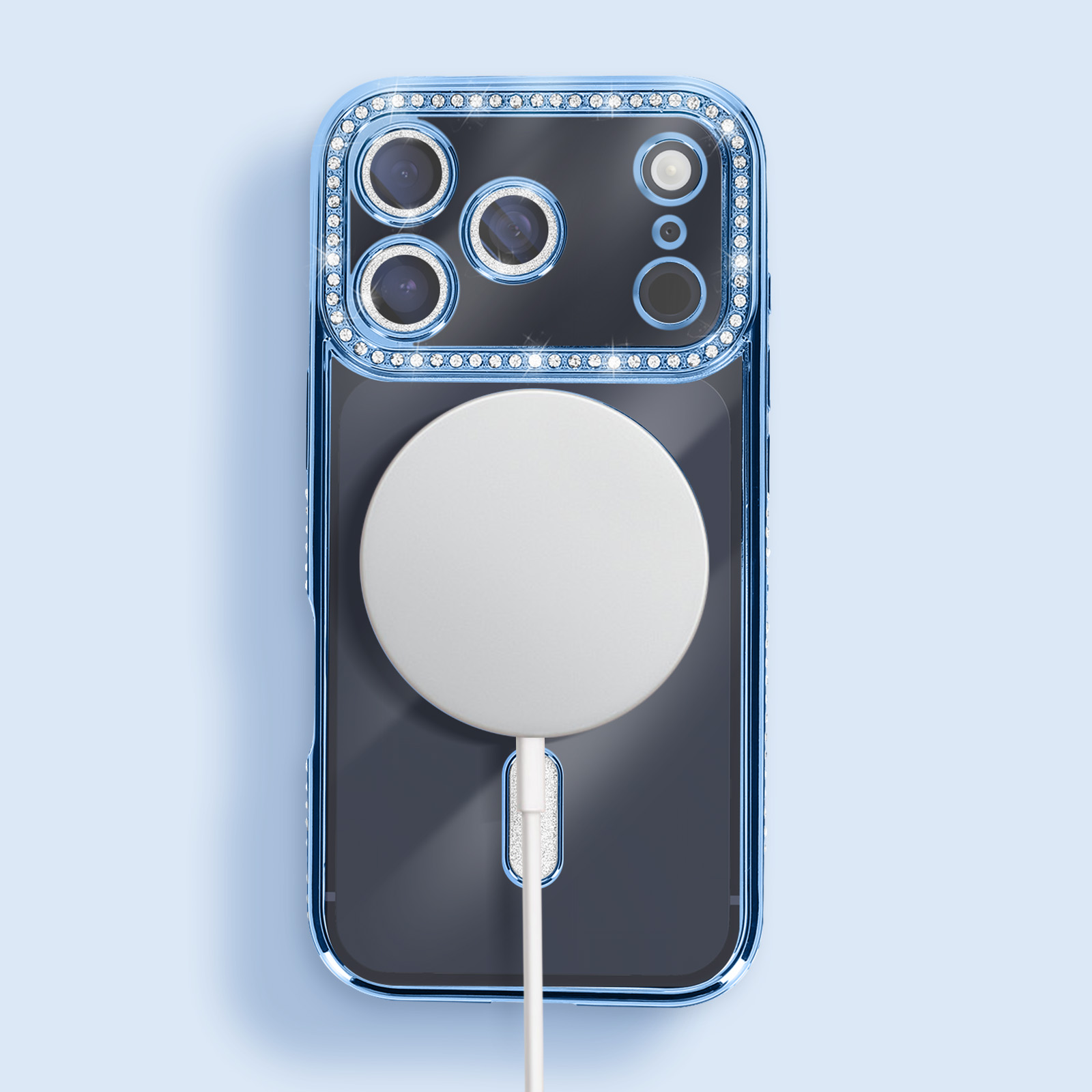 Une coque de téléphone avec un cadre bleu et des gemmes. Un cercle blanc au dos, relié à un câble de chargement.